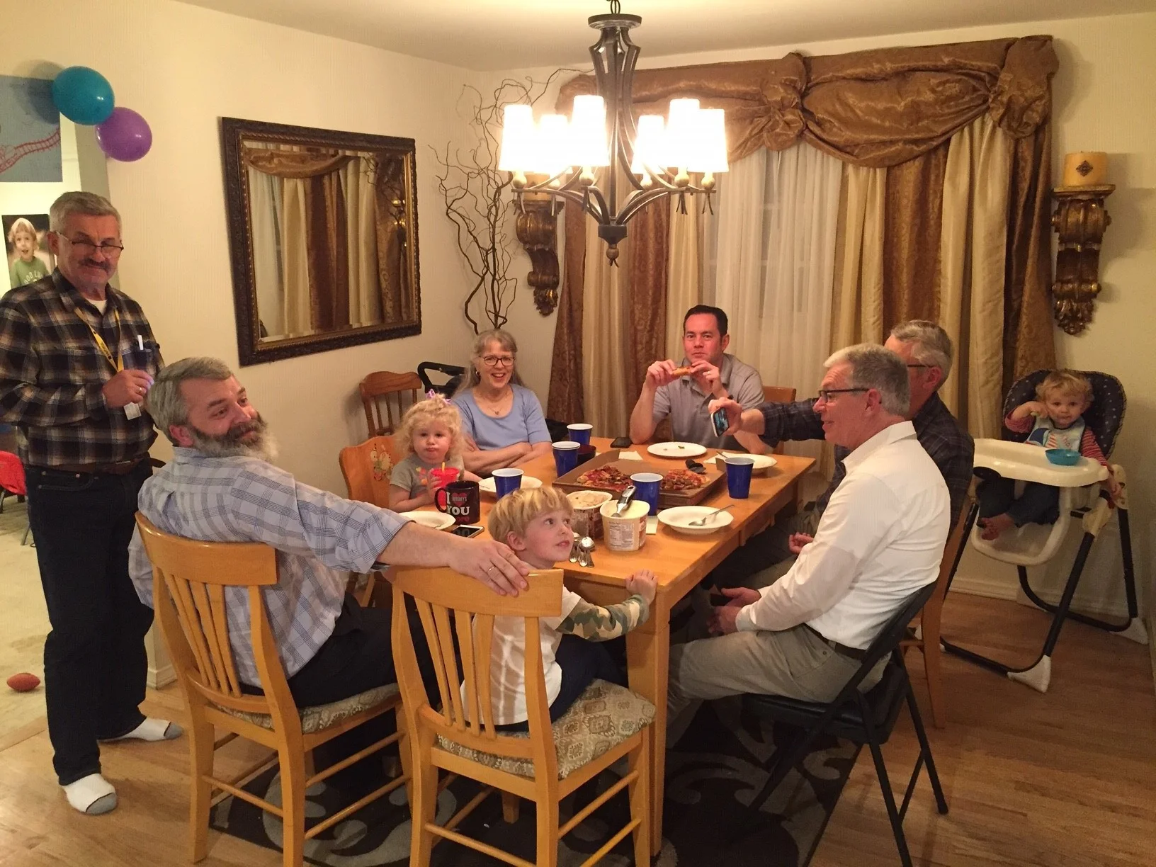 Our team gathering at our son Ezra’s house for pizza after the last service of the evening.