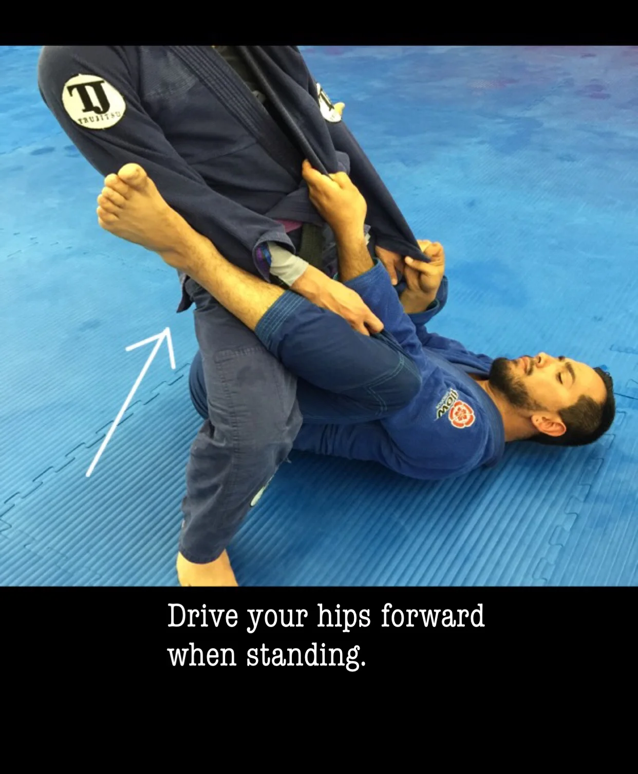 Driving your hips forward causes pressure and still allows you to keep balance. This also creates a frame with your legs that is good for defending the ankle/leg hook.