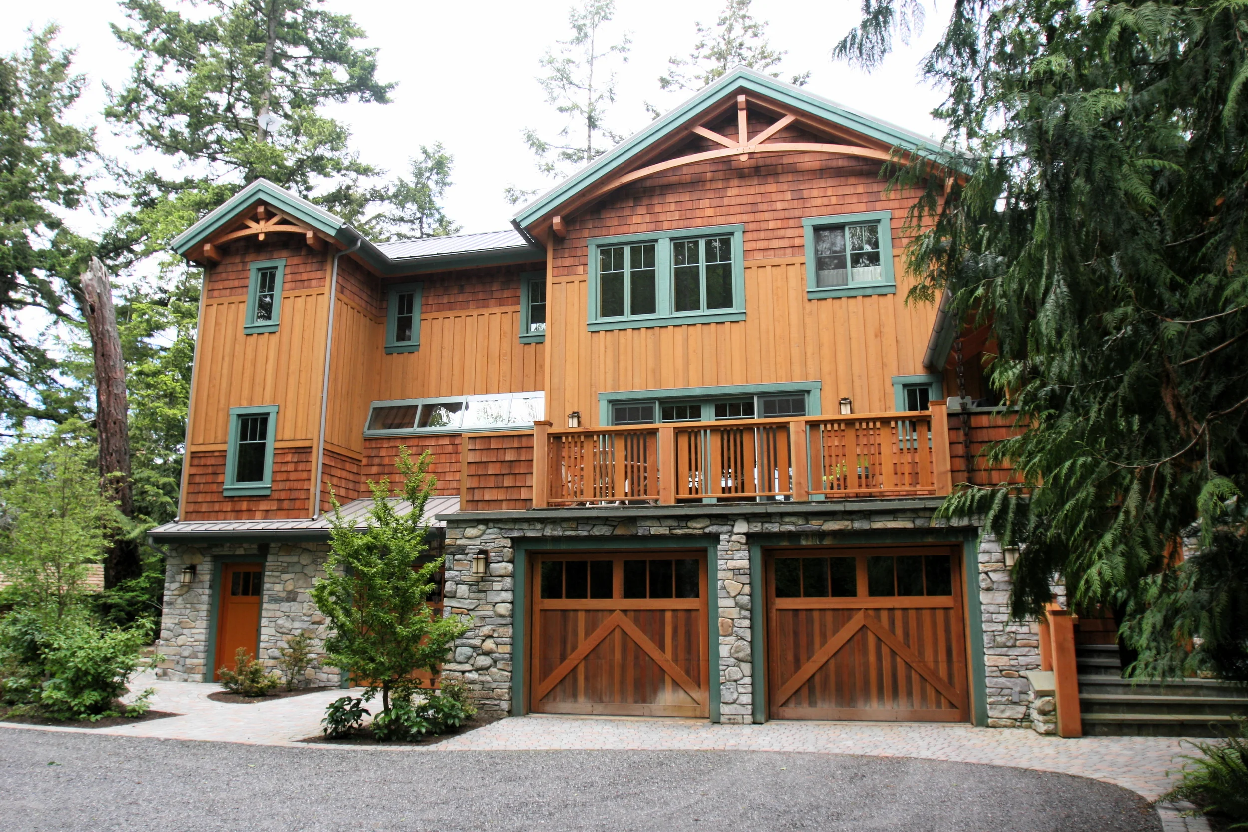 New Construction Timberframe with real rock masonry cladding on lower floor.