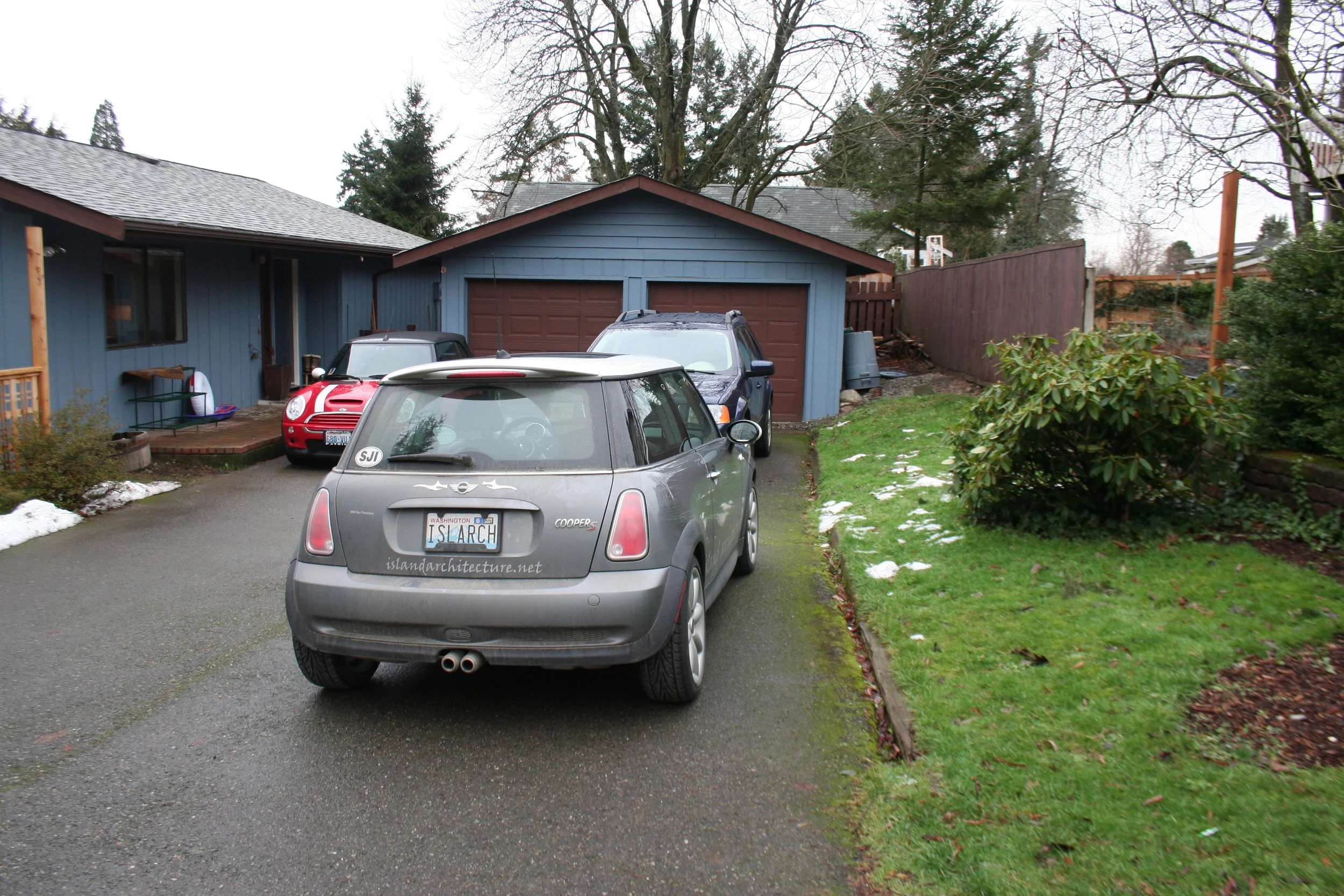 The house before had a side pocket entry and no second floor. By adding the new defined curved roof entry, the house is more welcoming.