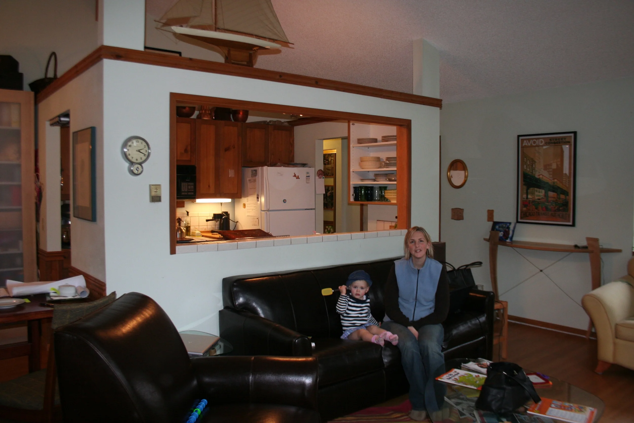 The kitchen before was inside the living room and a tiny cramped space walled off from the rest of the room.