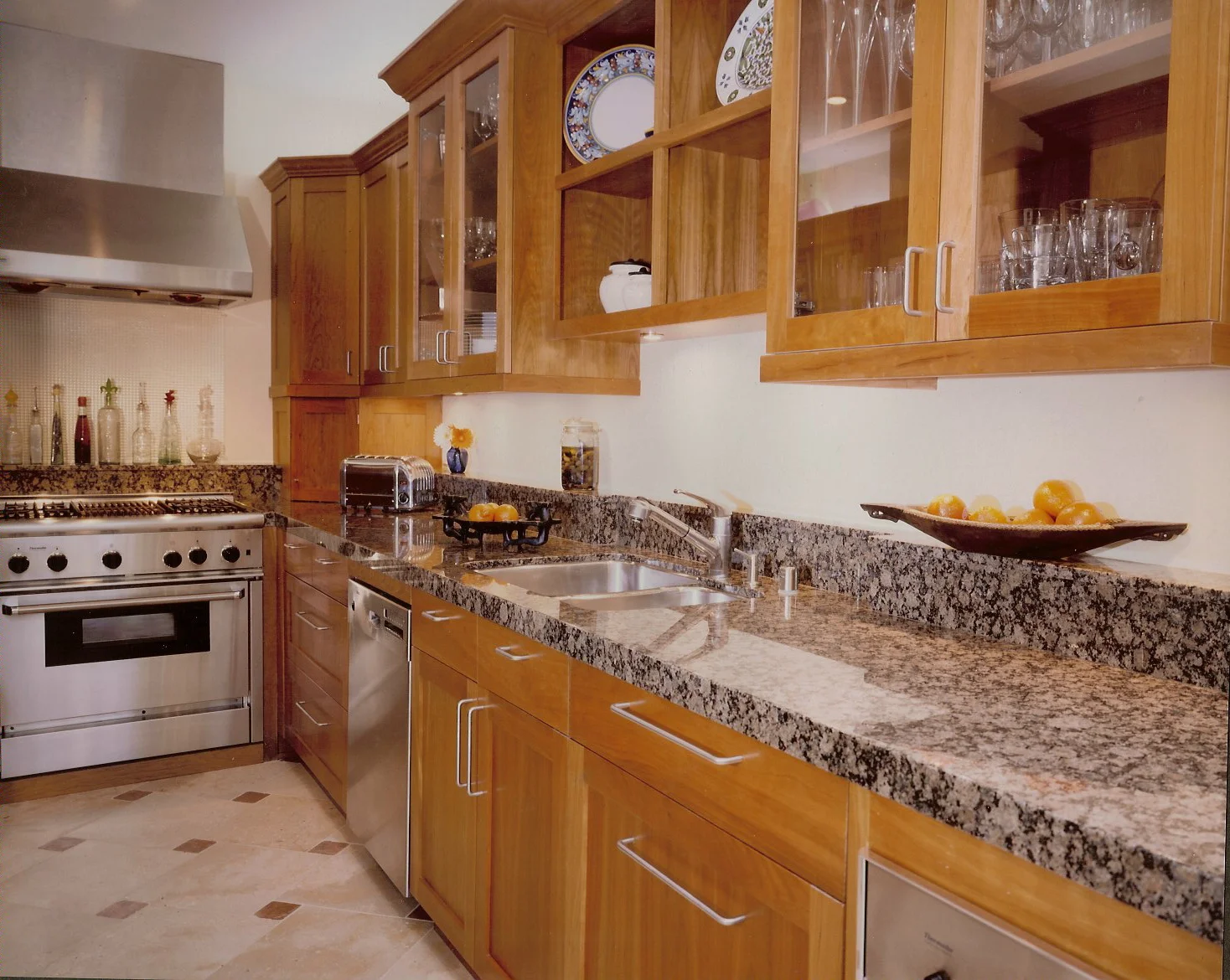 Kitchen in a SF Victorian has a Modern Flare with Cherry Cabinets and Limestone Floors with red marble diagonal accents. My signature shelf in the back works behind the stove, as well.