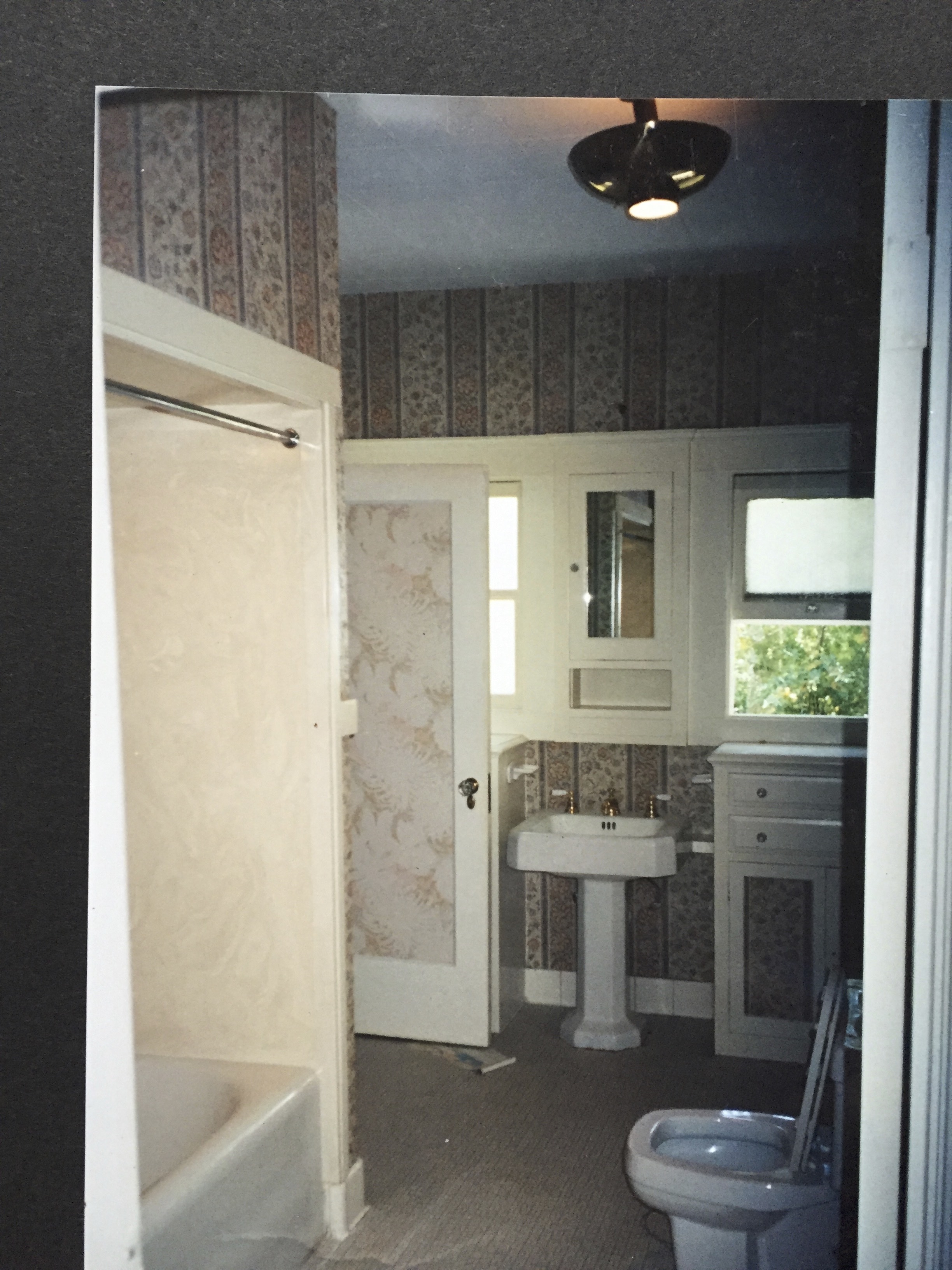 For some reason, in the old days, they would soffit down (drop the ceiling) over a shower to make it feel more cozy? Retain the heat?