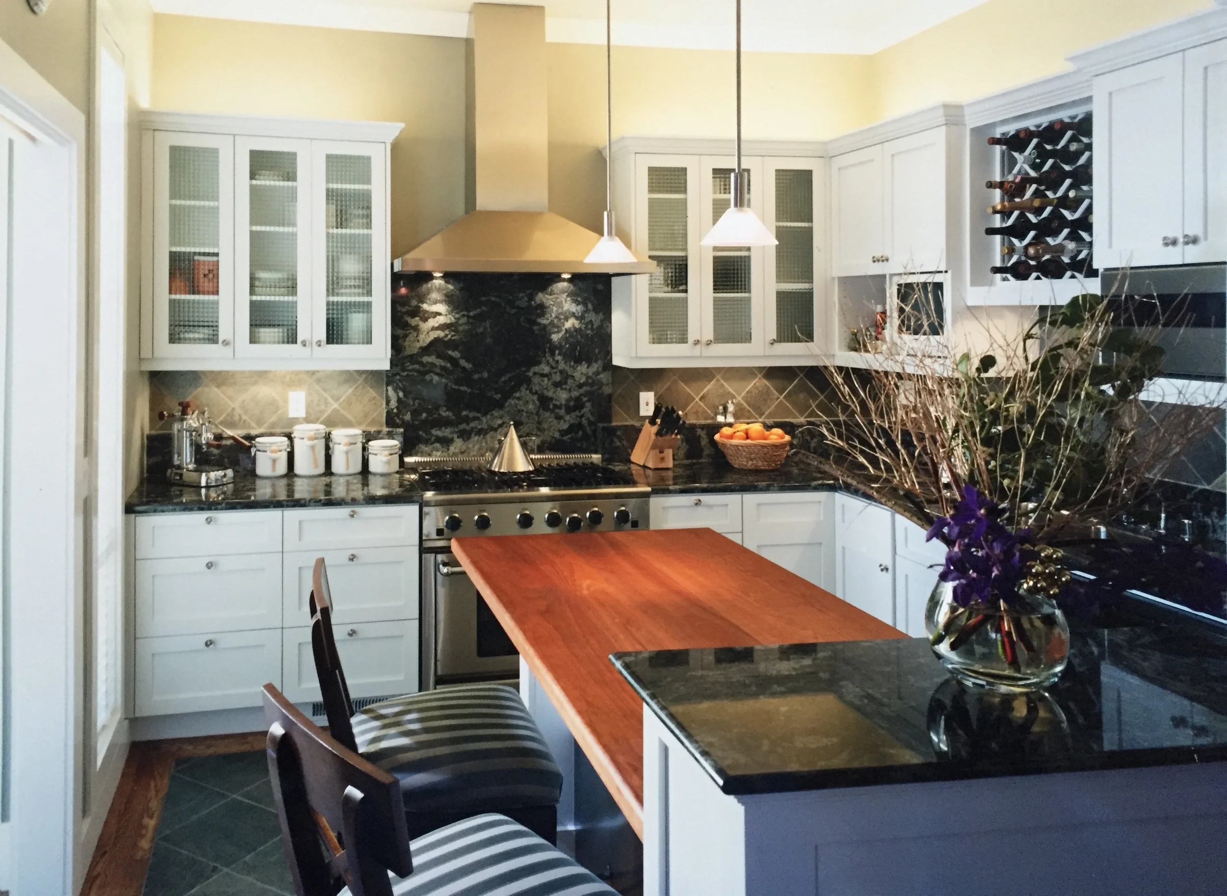 Up-lighting above the upper cabinets of this Victorian's kitchen remodel I did, gives the room a sense of being washed with light.
