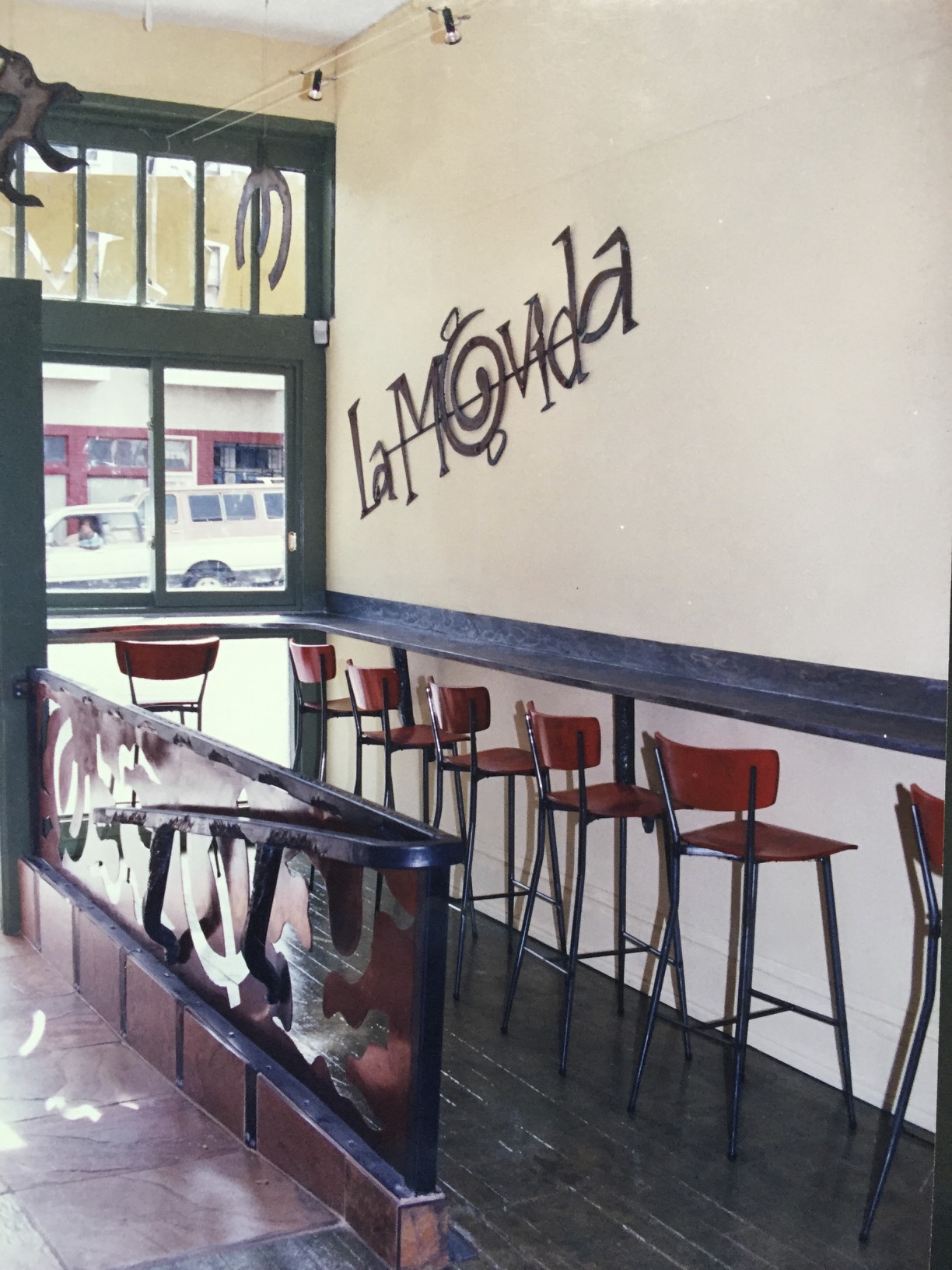 We used the metal cut-outs from the exterior sign on the wall of the restaurant. Metal cut-outs were also used on the guardrail of the entry ramp. The cut-outs were also used as hanging art= never waste a thing was out motto!