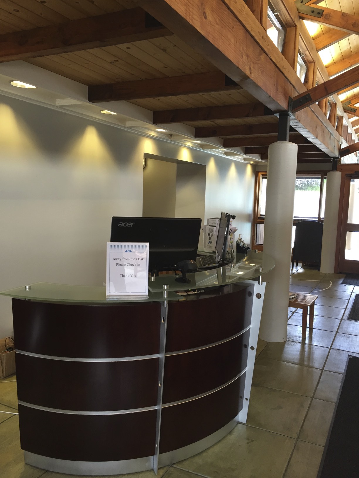 New Reception Desk is at the front of the entry to greet members.