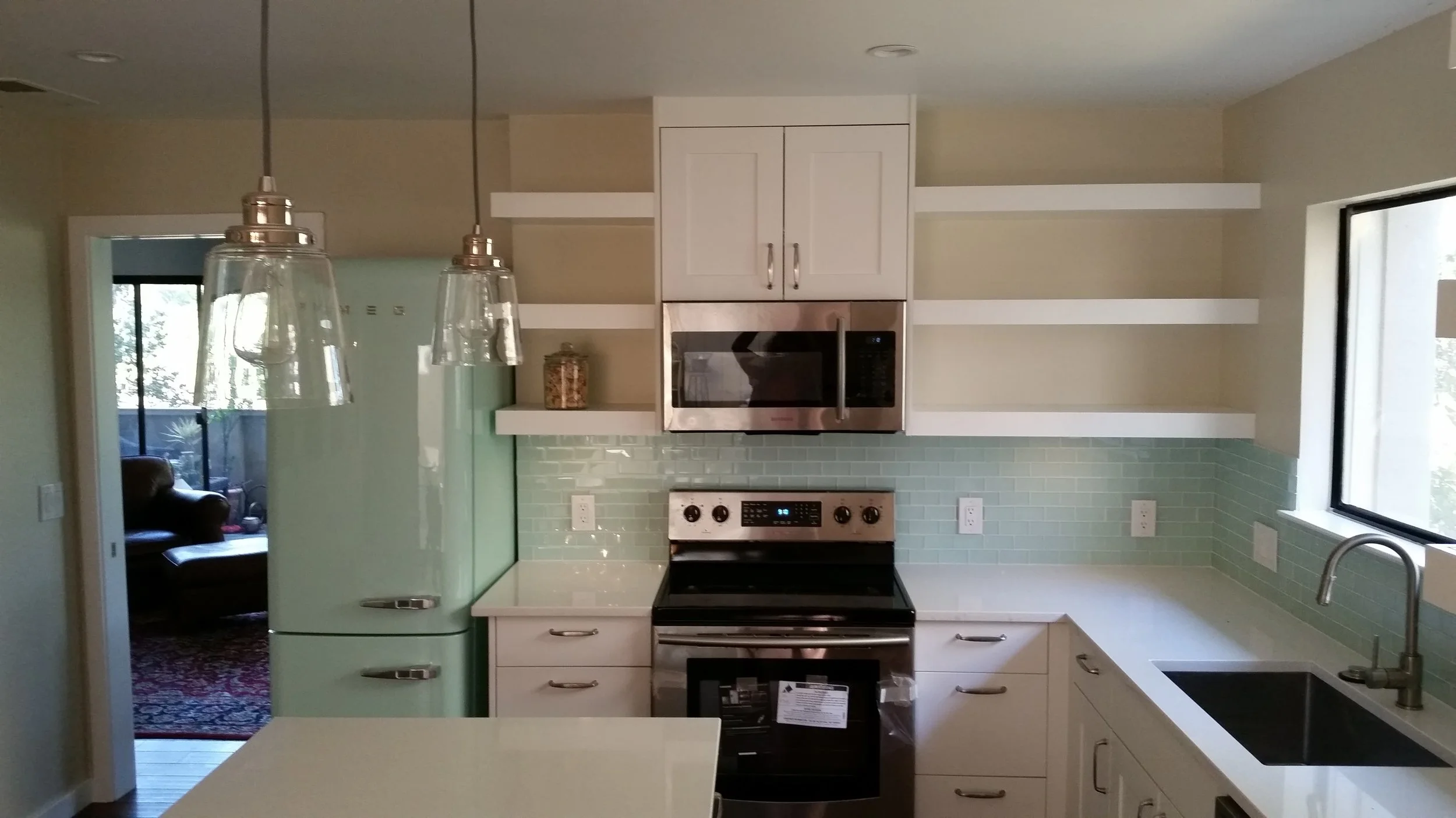 A "SMEG" Refrigerator adds flare to this kitchen!