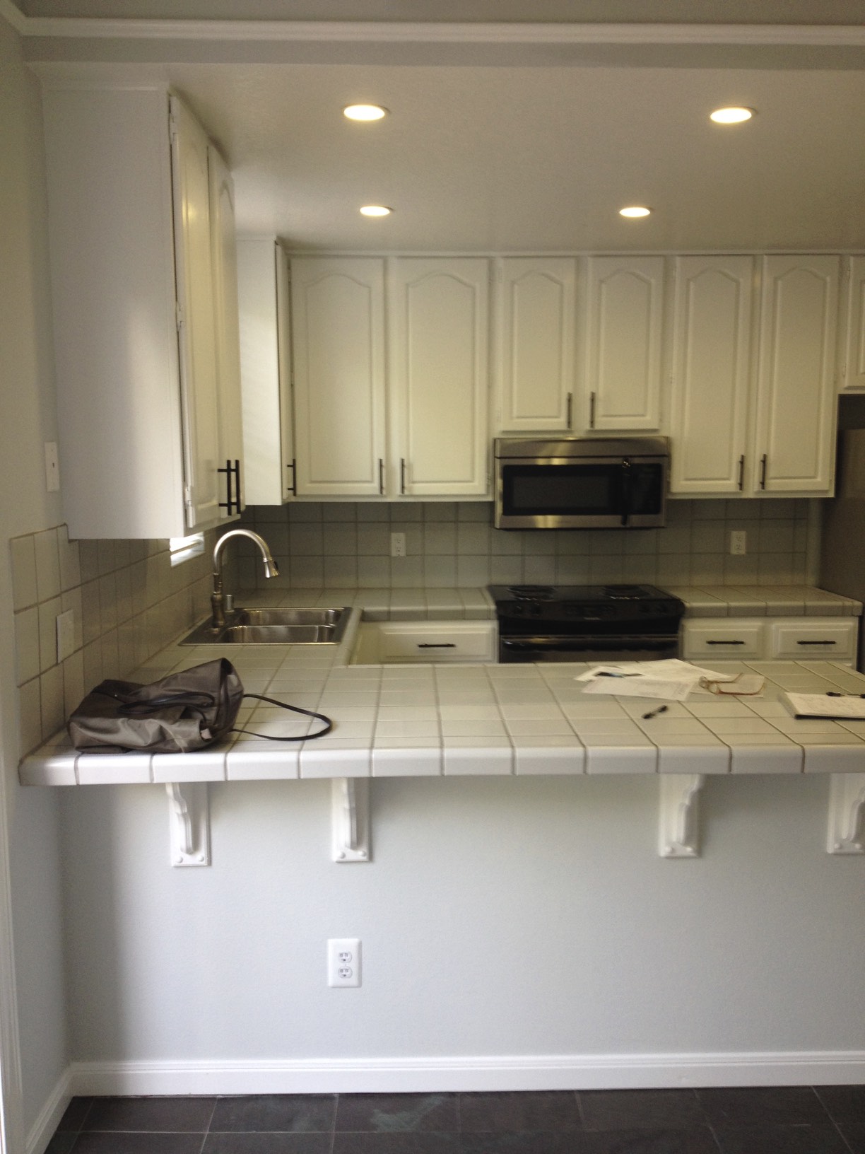 This was the kitchen before- it was cramped and tight with a counter- note the location of all the fixtures. We kept them all in the same location, as the basic configuration worked.