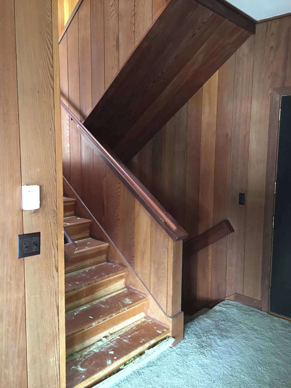 Even though the stairway before had original redwood paneling from 1954, it was tired looking. It was all enclosed and dark feeling.