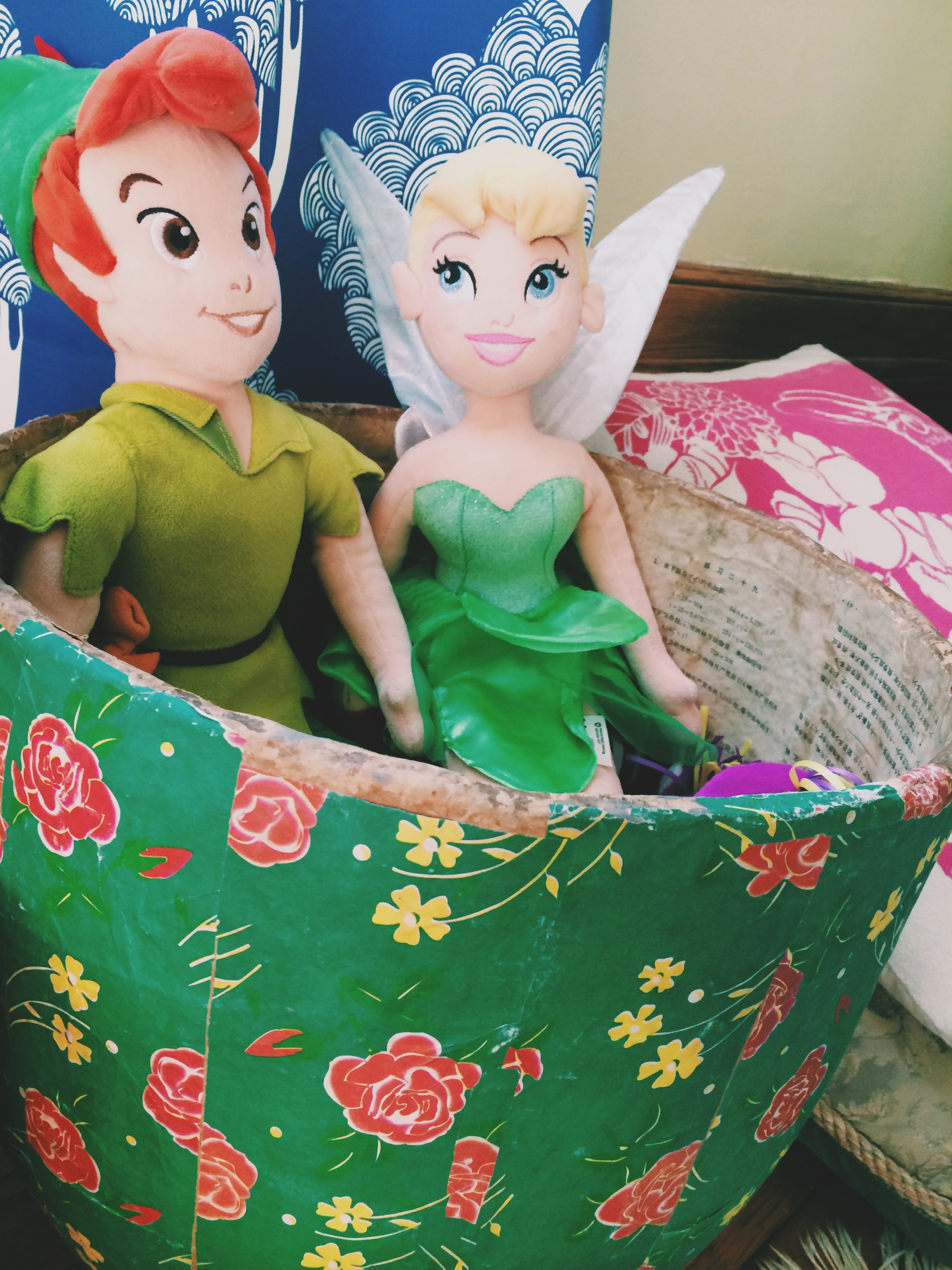  Repeat after me...toy storage can be beautiful and functional! Vintage floral basket from Shabby Chic. Rabbit pillow from Erin Flett for my husband's mother "Bunny" who watches over us. Tinkerbell and Peter Pan because magic is very alive for both t