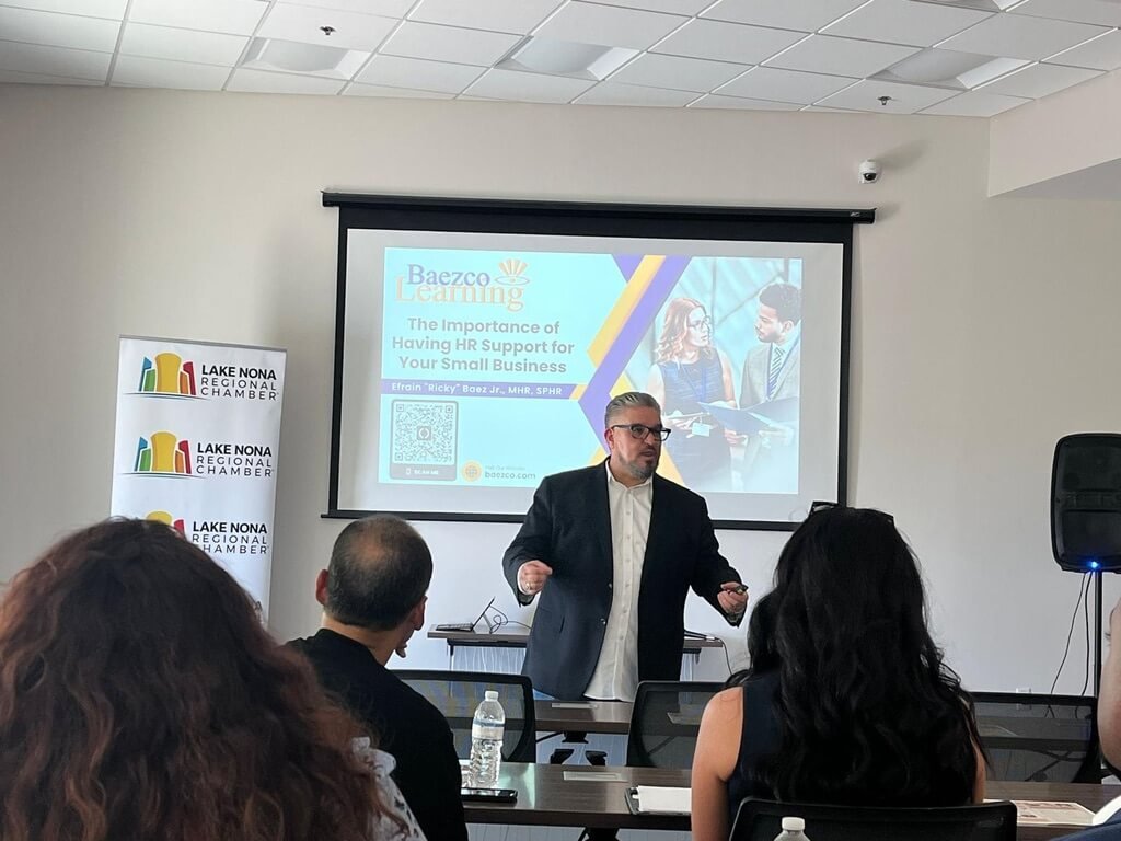 Ricky Baez Jr. of Baezco Learning delivering a fractional HR consulting presentation to the Lake Nona Regional Chamber of Commerce