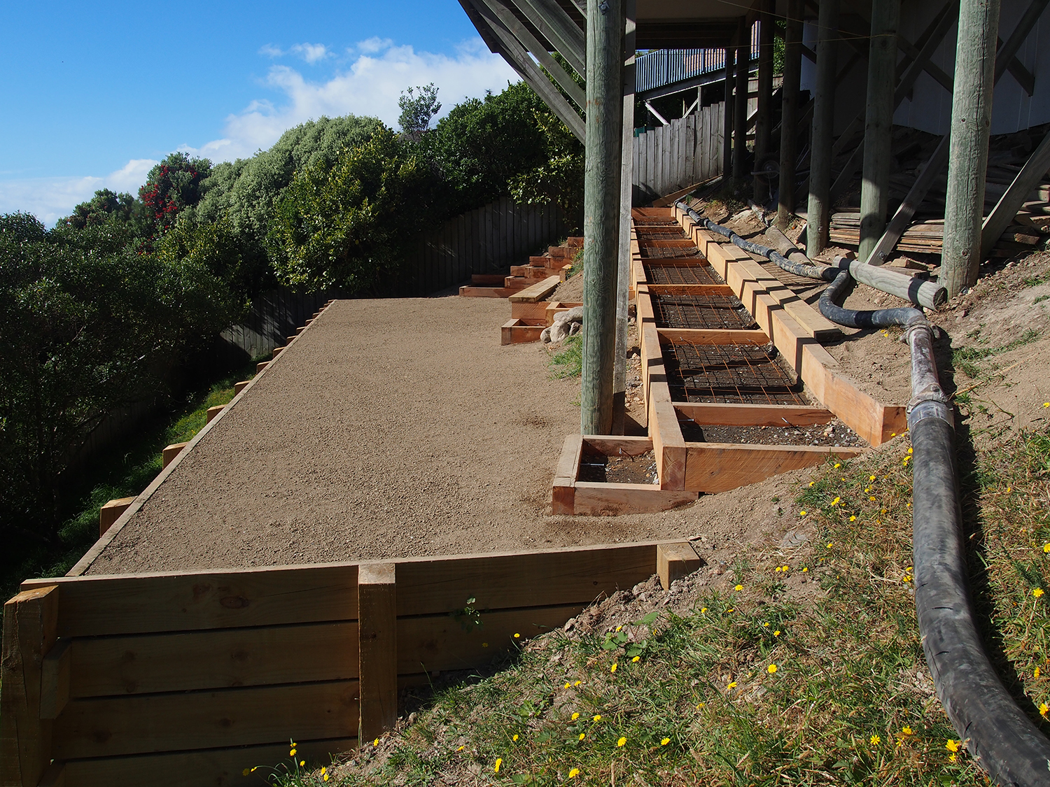 11.1 Retaining wall completed steps and ramp underway