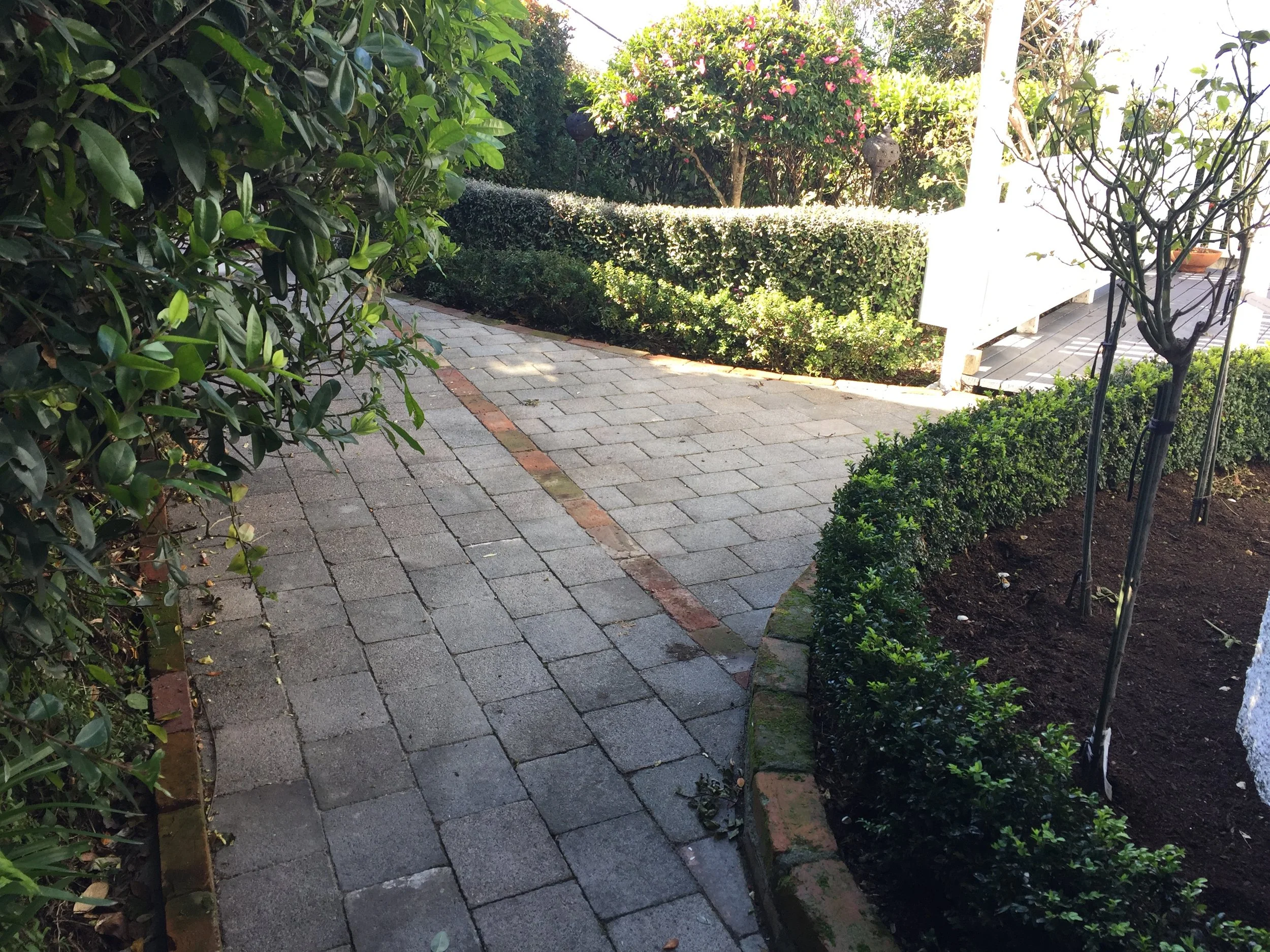 Re-laid pavers directing visitors to entrance door