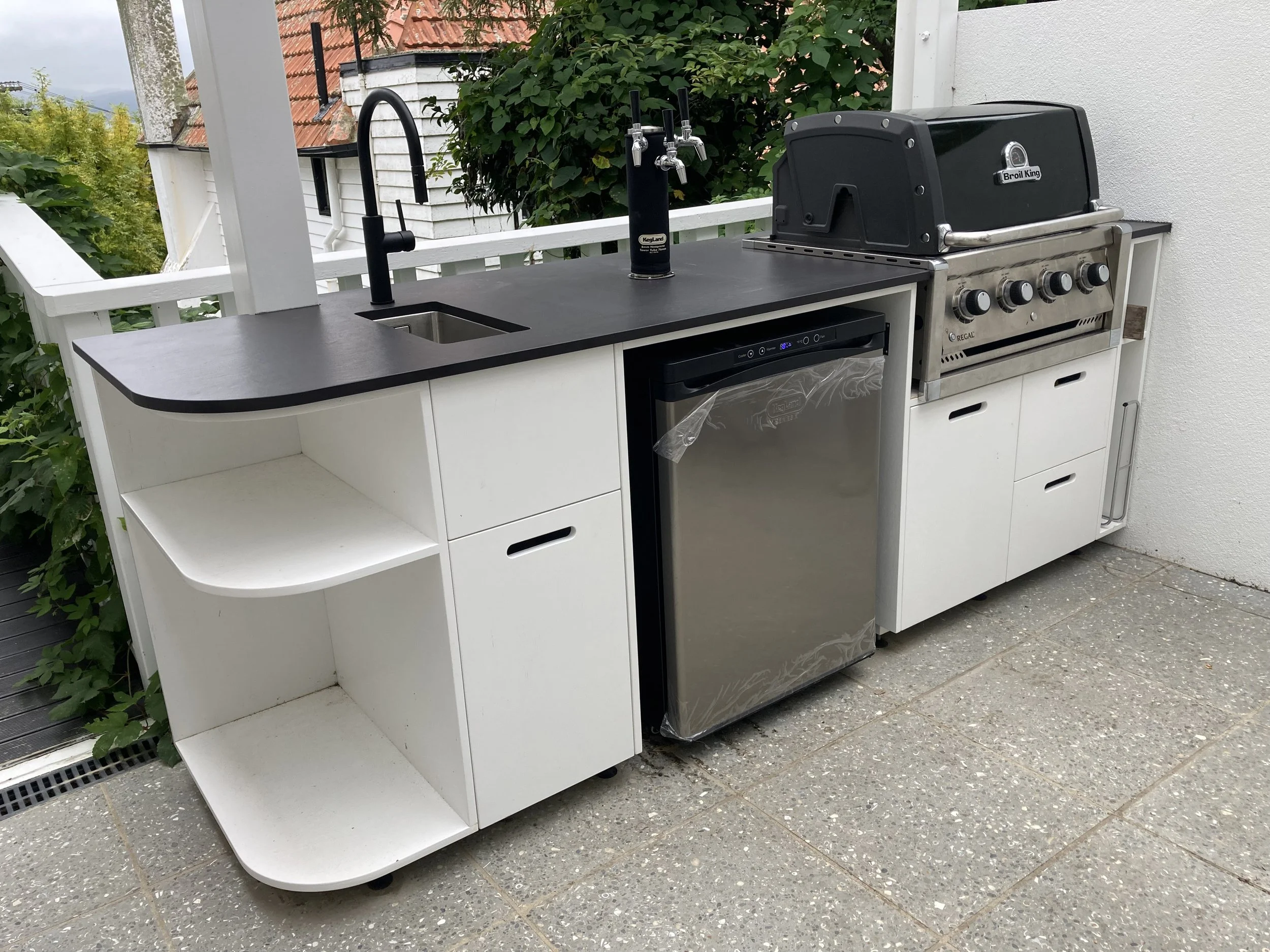 BBQ cabinetry to accommodate dispenser for home brew 