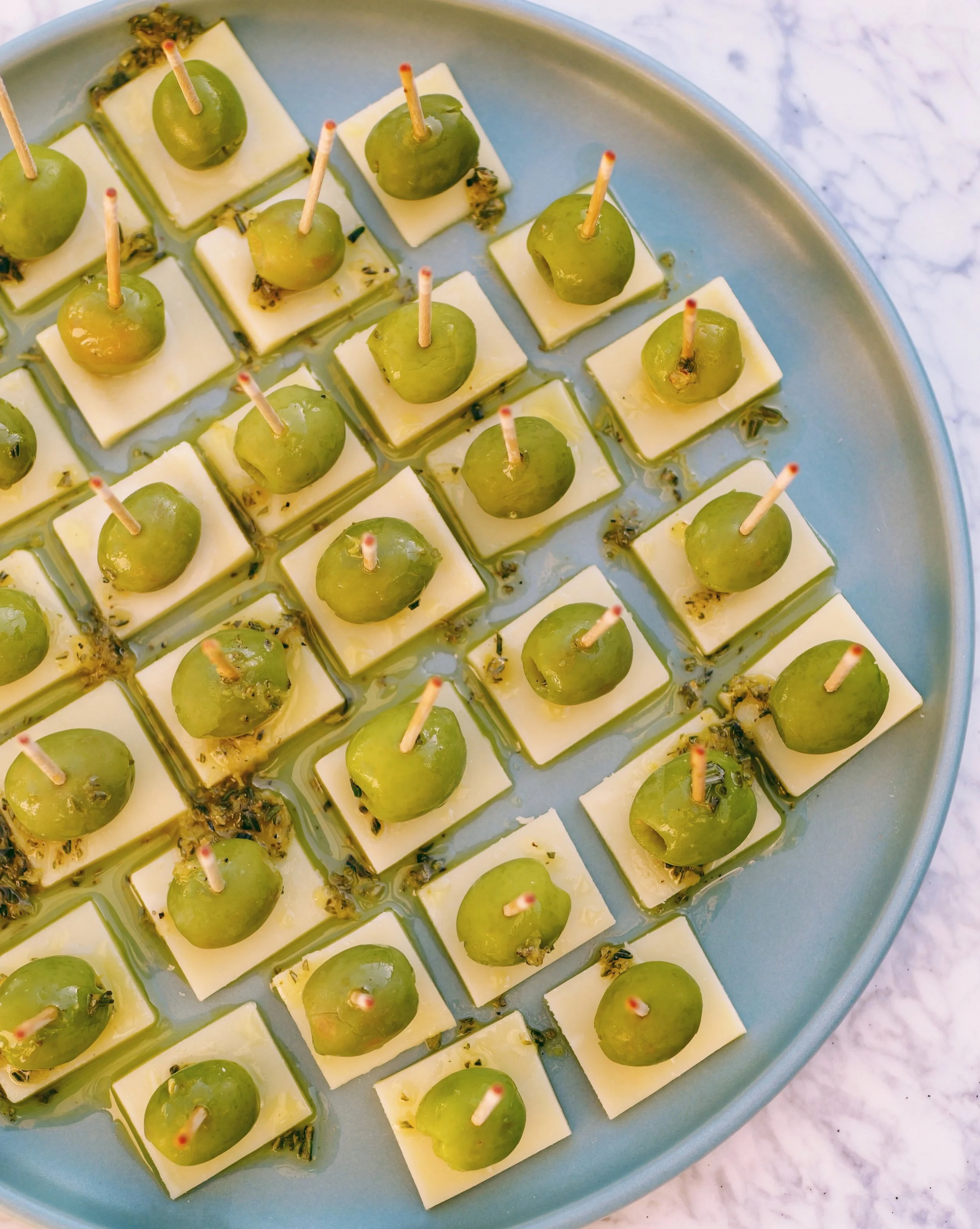 Green Olive &amp; Gruyère Skewers with Lemon-Herb Drizzle