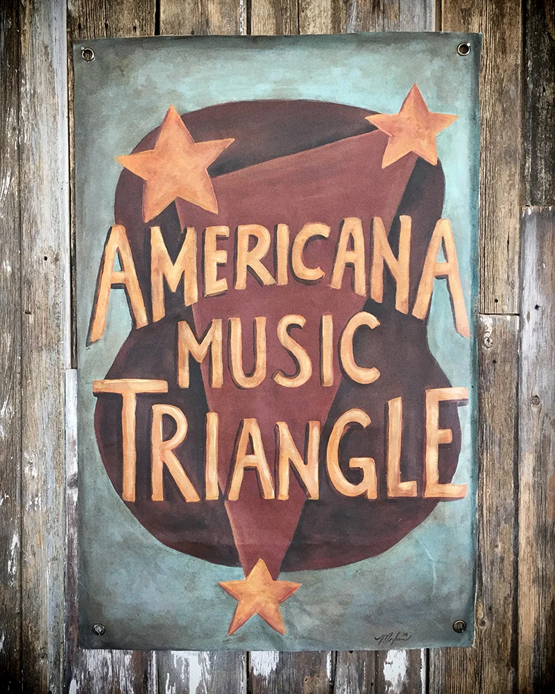 Hand painted poster for the Americana Music Triangle on stage at the Pilgrimage Festival 2018