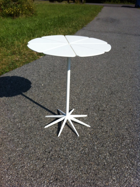 Petal End Table features steel 'stem and roots', powder coated in white, plastic white petals.
