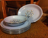 Homer Laughlin "Skytone". These cames in solids and decorated pieces. This is only one of the decorations available. What I love about Skytone is that they used blue clay! One of my plates is chipped along the edge and you can see that the clay is solid blue! I just think they are awesome. HL is still in business today making a lot of dishes for restaurants. Their mid century pieces were definitely the cream of the crop and are very collectable today! Homer Laughlin is also responsible for FIESTA WARE, you may have heard of it. :)