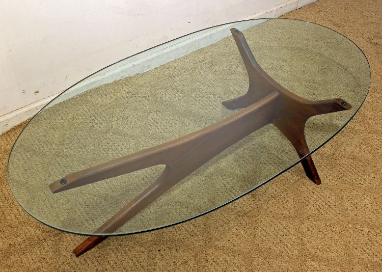 Not as sexy with this glass. I suspect it may not be original. Glass is super expensive to have cut and if you do not have the original shape traced to give the shop, you get this.