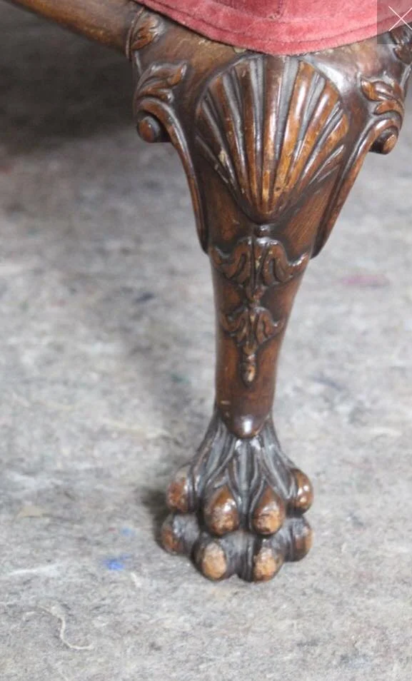 This foot is known as a lion's paw foot. Another popular foot style on Chippendale furniture is the Ball and Claw, which is literally an eagle claw holding a ball. A note on the shell referring to early 1900s Chippendale reproductions: Shell motifs carrying over from the Queen Anne period may be present, but are not as prevalent in this style as they were earlier in the 1700s.
