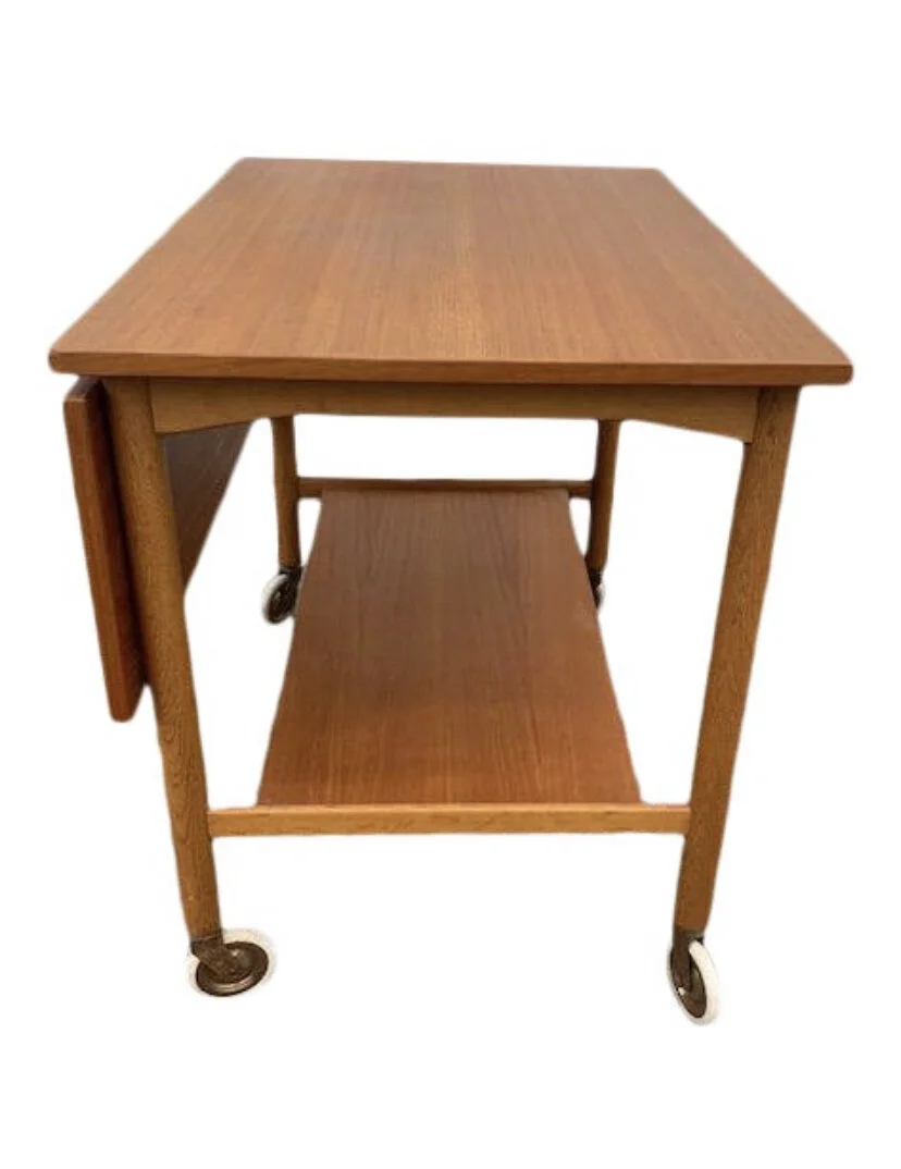 Fun teak cart that has a pivoting top to extenD the drop leaf.  Gemla, Sweden