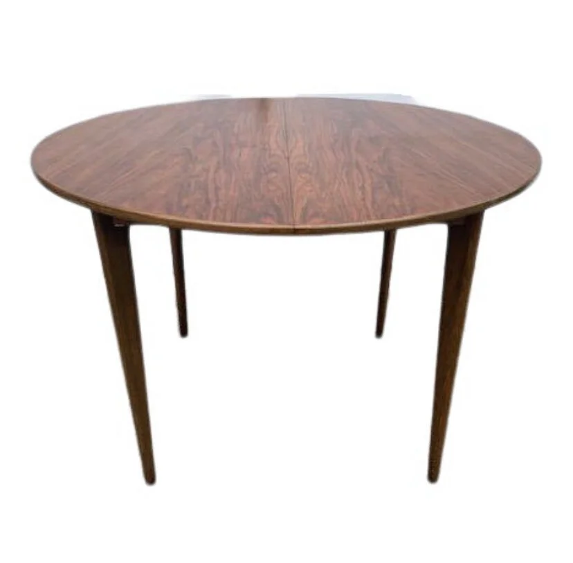 AB Seffle MobElfaBrik -sweden, rosEwood extenSion dining table.  Includes 2 17” leaves, full set of custom table padS.  Legs remove for easier transit.