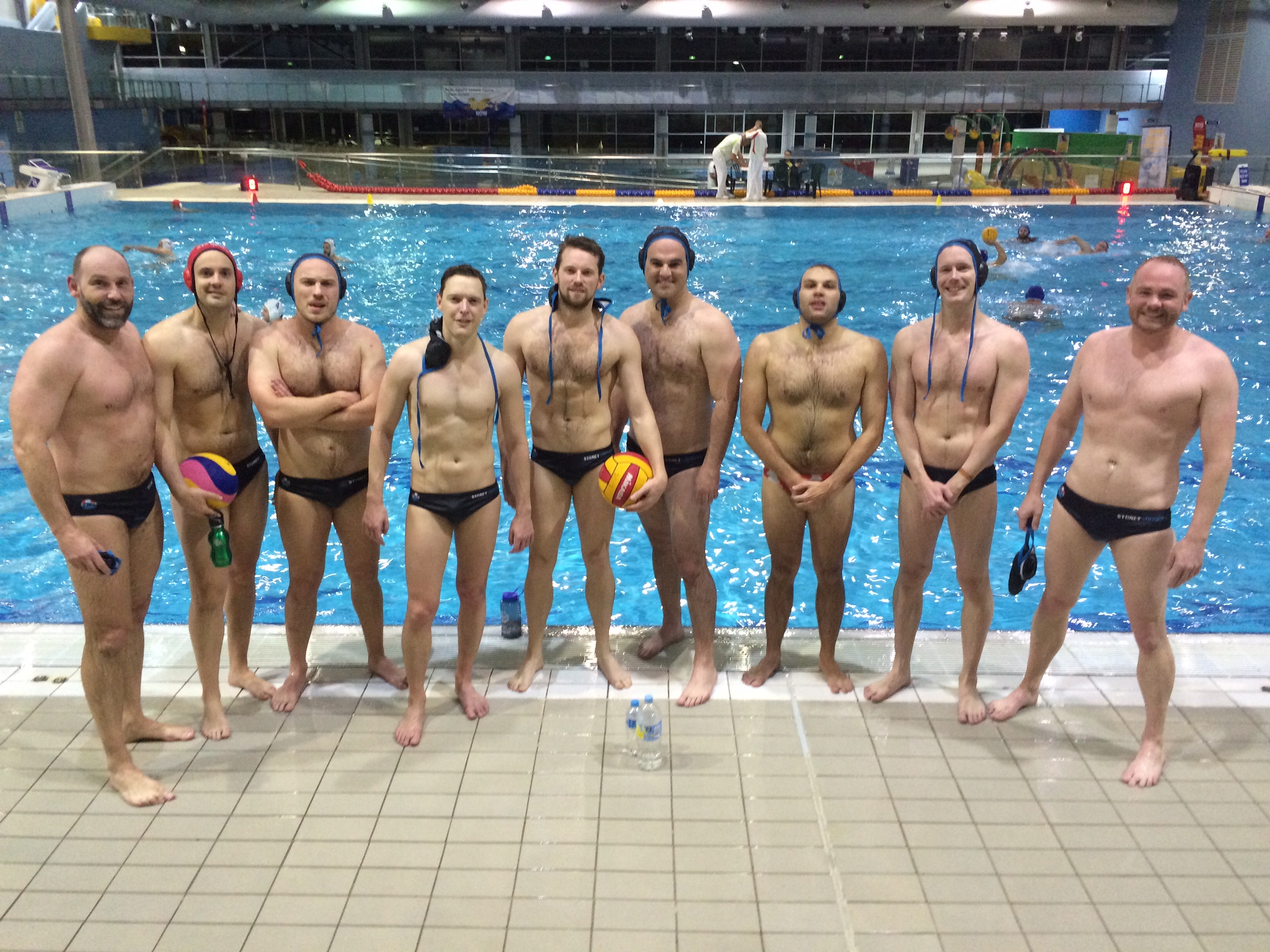 Sydney Stingers team smiling after a home competition at Ryde Aquatic Centre