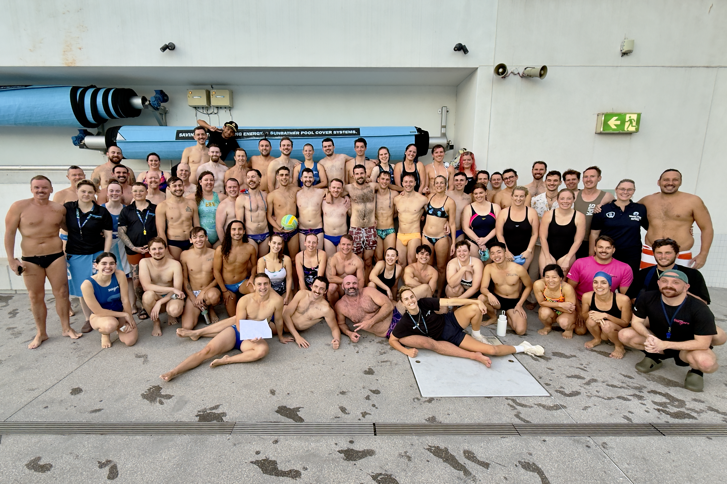 Large group of Sydney Stingers members gathered at the pool for a team photo.
