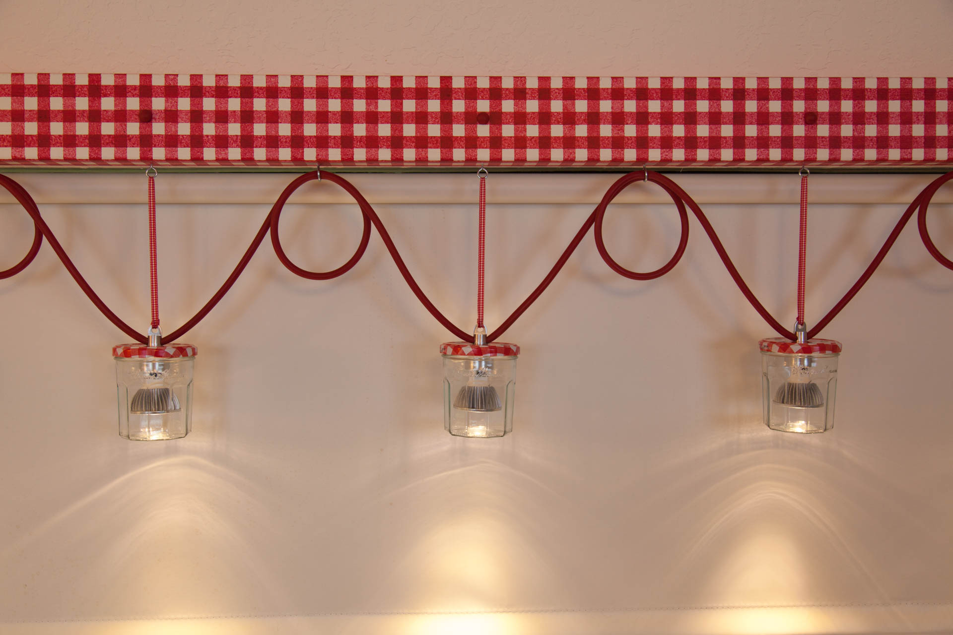  Wires run through red surgical tubing to the light bulbs. 