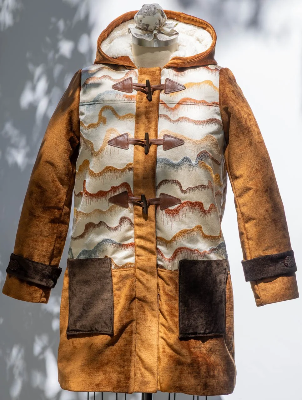  Two heavy chenille fabrics in coordinating colors supplement the scrap I liked the most.  The whole coat is lined with a sherpa fleece, making it hibernation ready. 