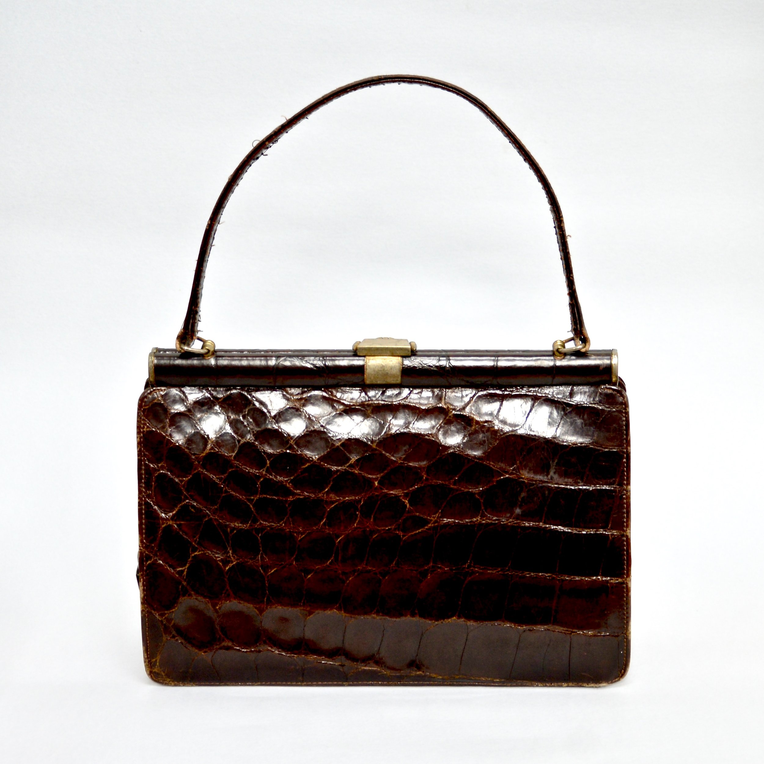 An L. Magnum & Co chocolate brown 1950s alligator handbag once owned  News Photo - Getty Images