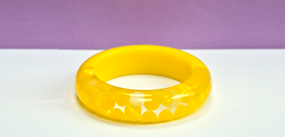 yellow, clear, &amp; white, thick-walled bangle with aspirin dot inclusions. mod. mcm. valley of the dolls.