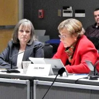 Vice-Chair Judy Walsh delivers committee report as PUC Chair DeAnn Walker listens | © RTO Insider
