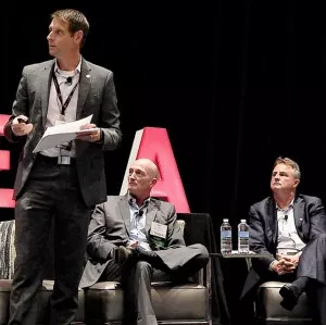 Younicos’ Dean Tuel (center) and ATG Energy’s Patrick Woodson listen as Skaia Energy’s Ingmar Sterzing explains TREIA’s 50% by 2030 plan. | © RTO Insider