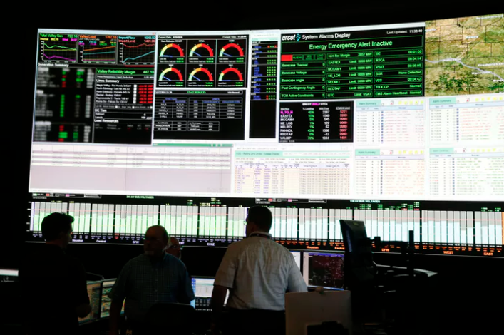 System operators work in the command center of the Electric Reliability Council of Texas in Taylor, Texas on Tuesday, May 15, (Vernon Bryant/Staff Photographer)