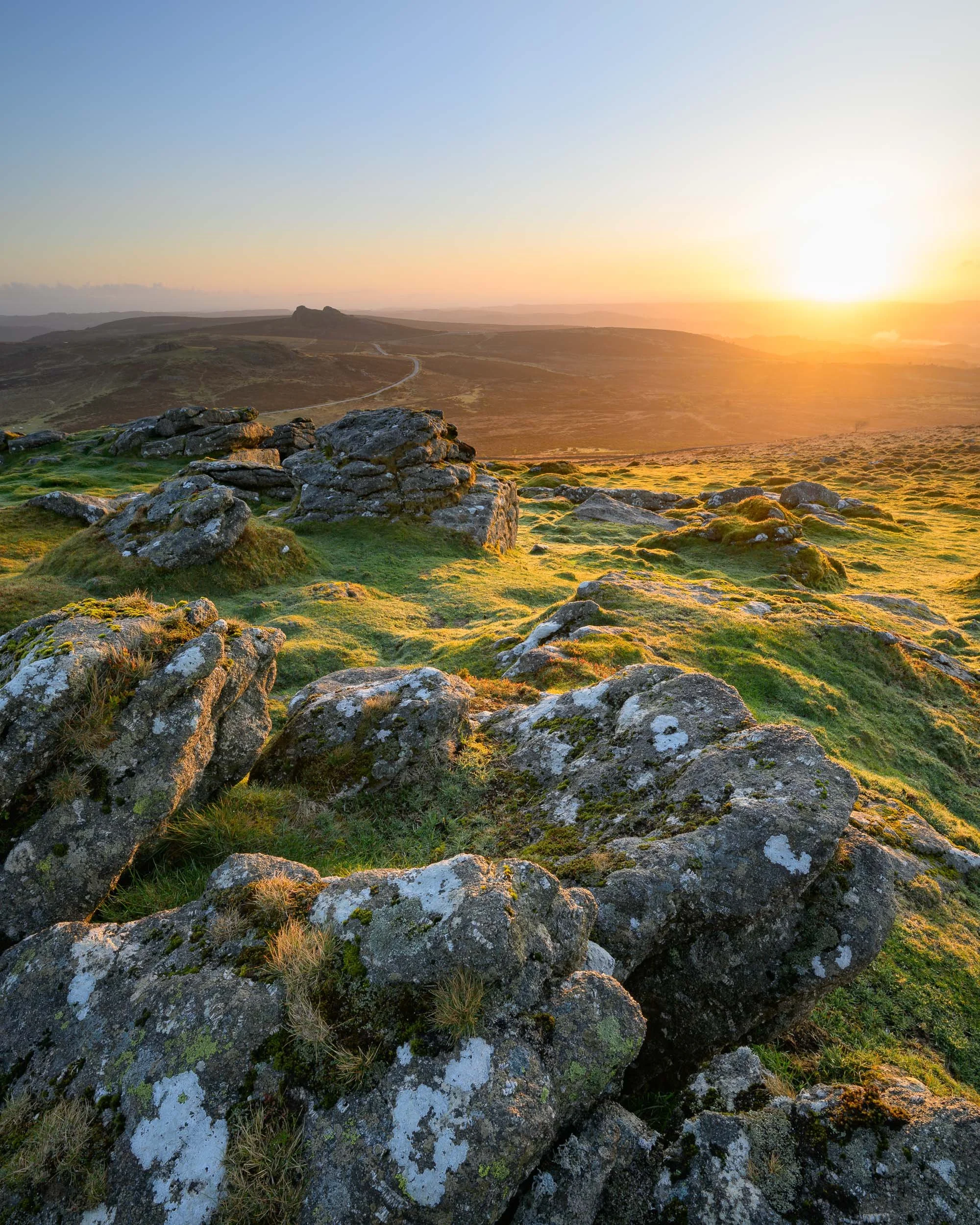 A sunrise landscape photograph of Rippon Tor on Dartmoor National Park