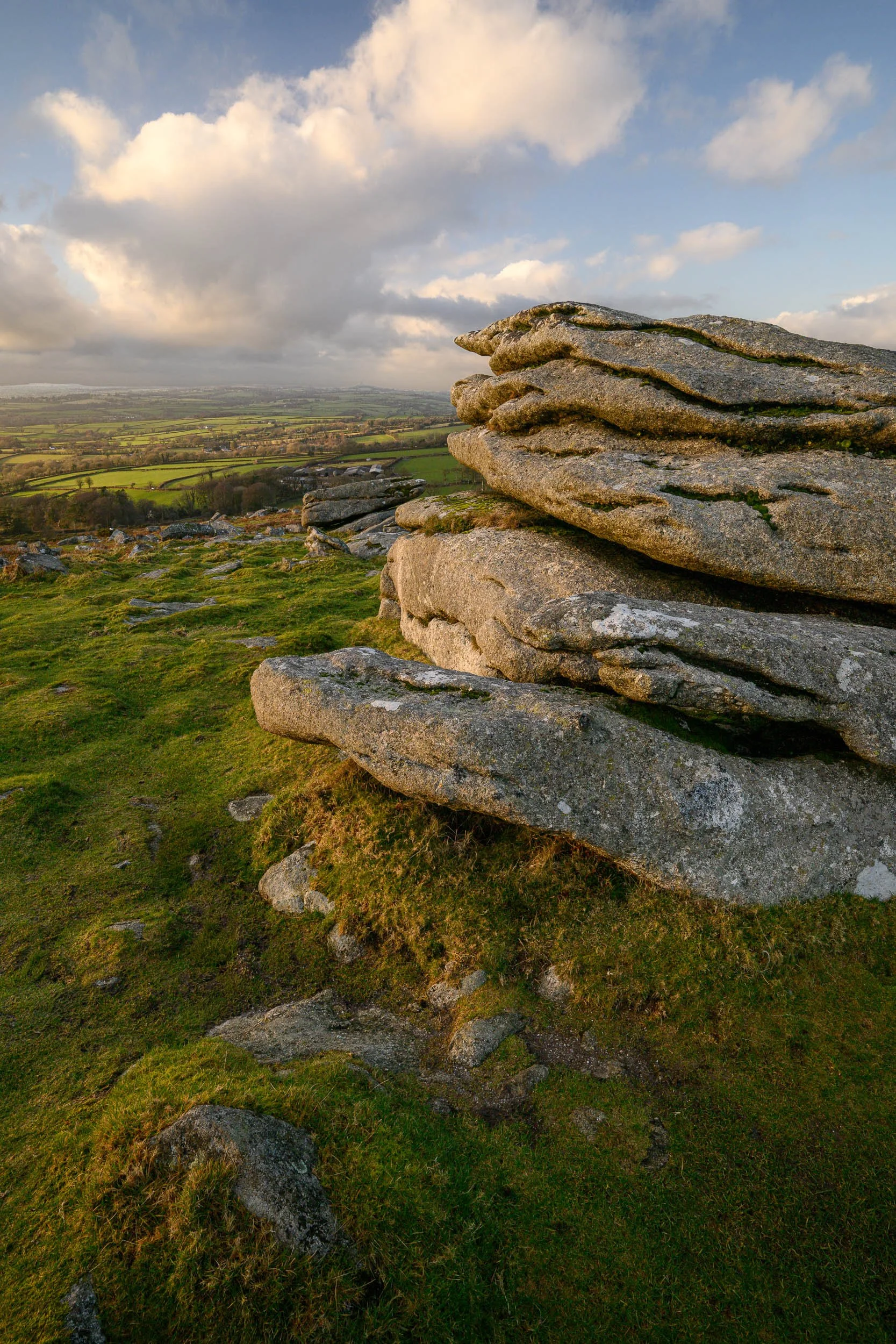 A landscape photograph of Pew Tor on Darmoor taken at sunset.