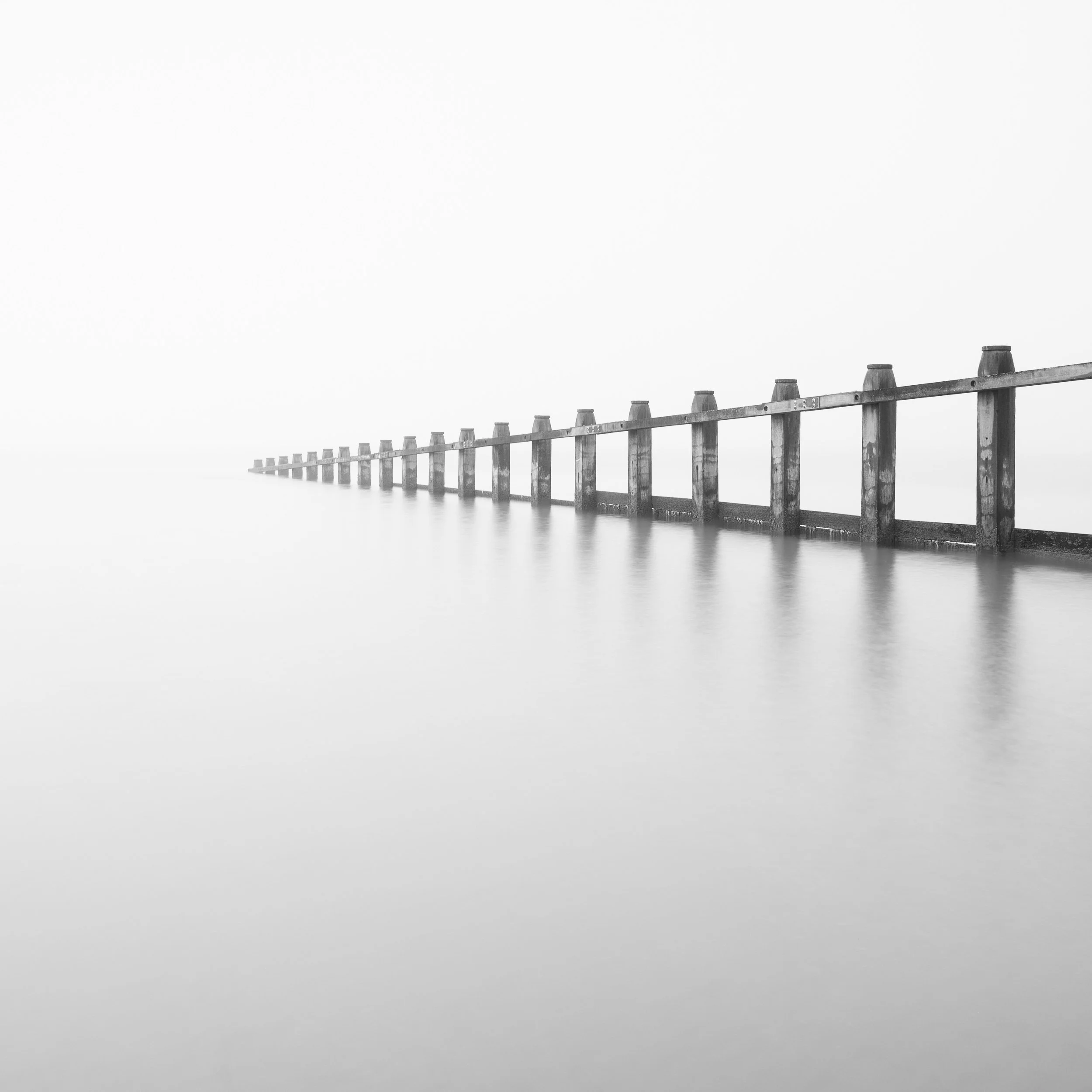 A minimal style photograph of a groyne on Dawlish Warren