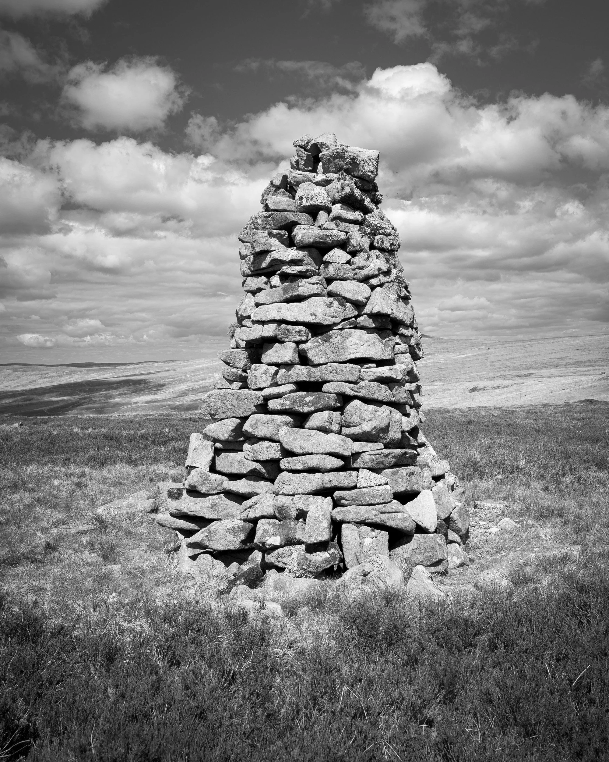 A black and white photograph of Fiend's Fell on the Pennines.