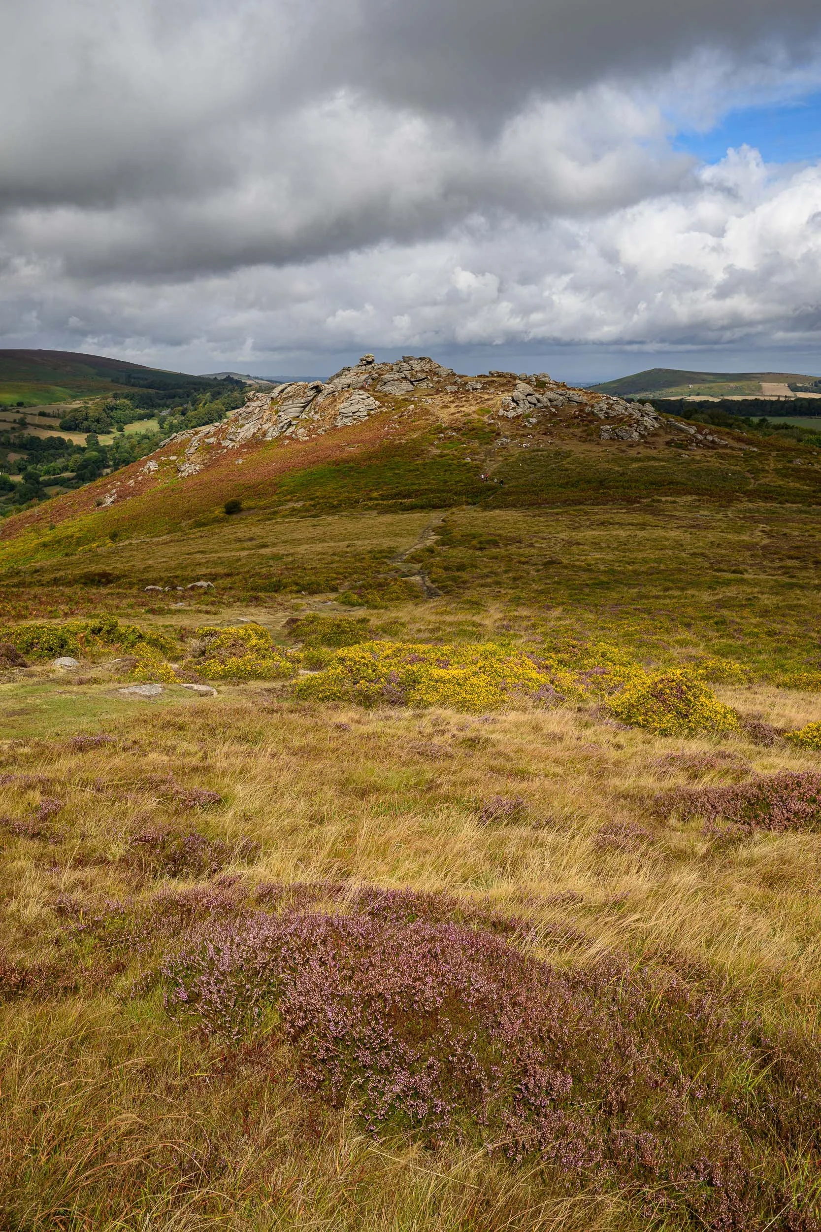 Honeybag Tor in the distance illuminated by the sun during the day on Dartmoor National Park