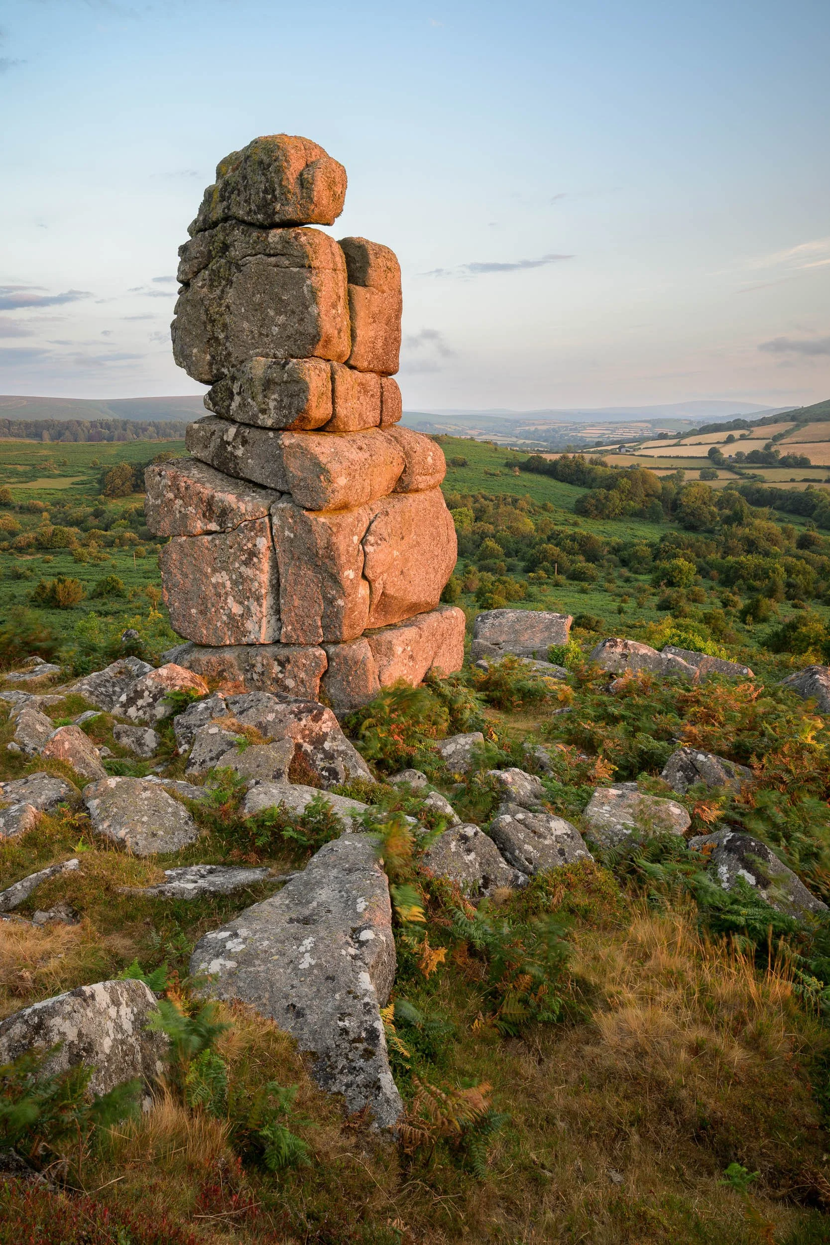 A landscape photograph of Boiwerman's Nose on Dartmoor at sunrise