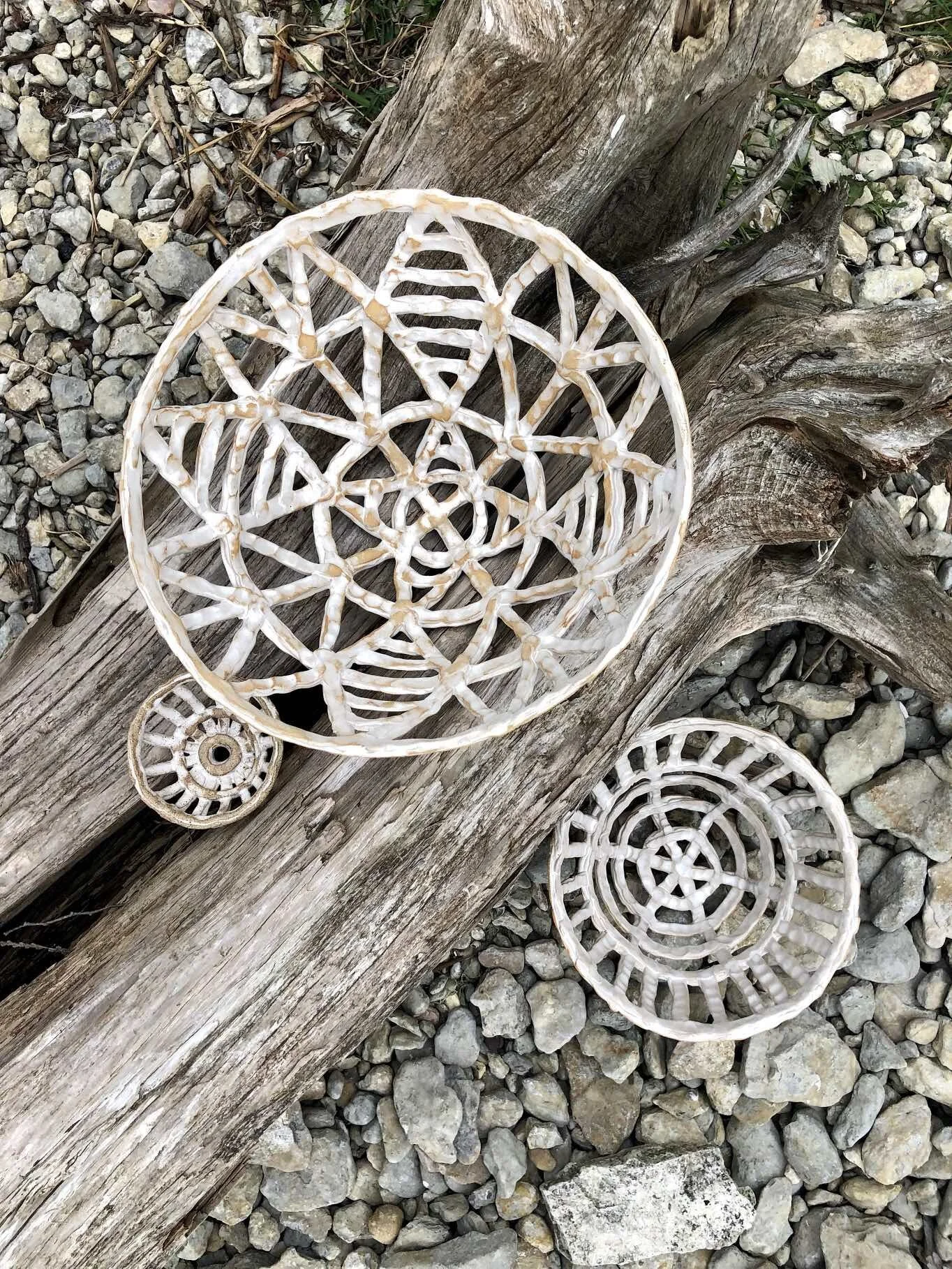Michigan ceramic artist Katie Bramlage's cavebasket cluster on log.jpg