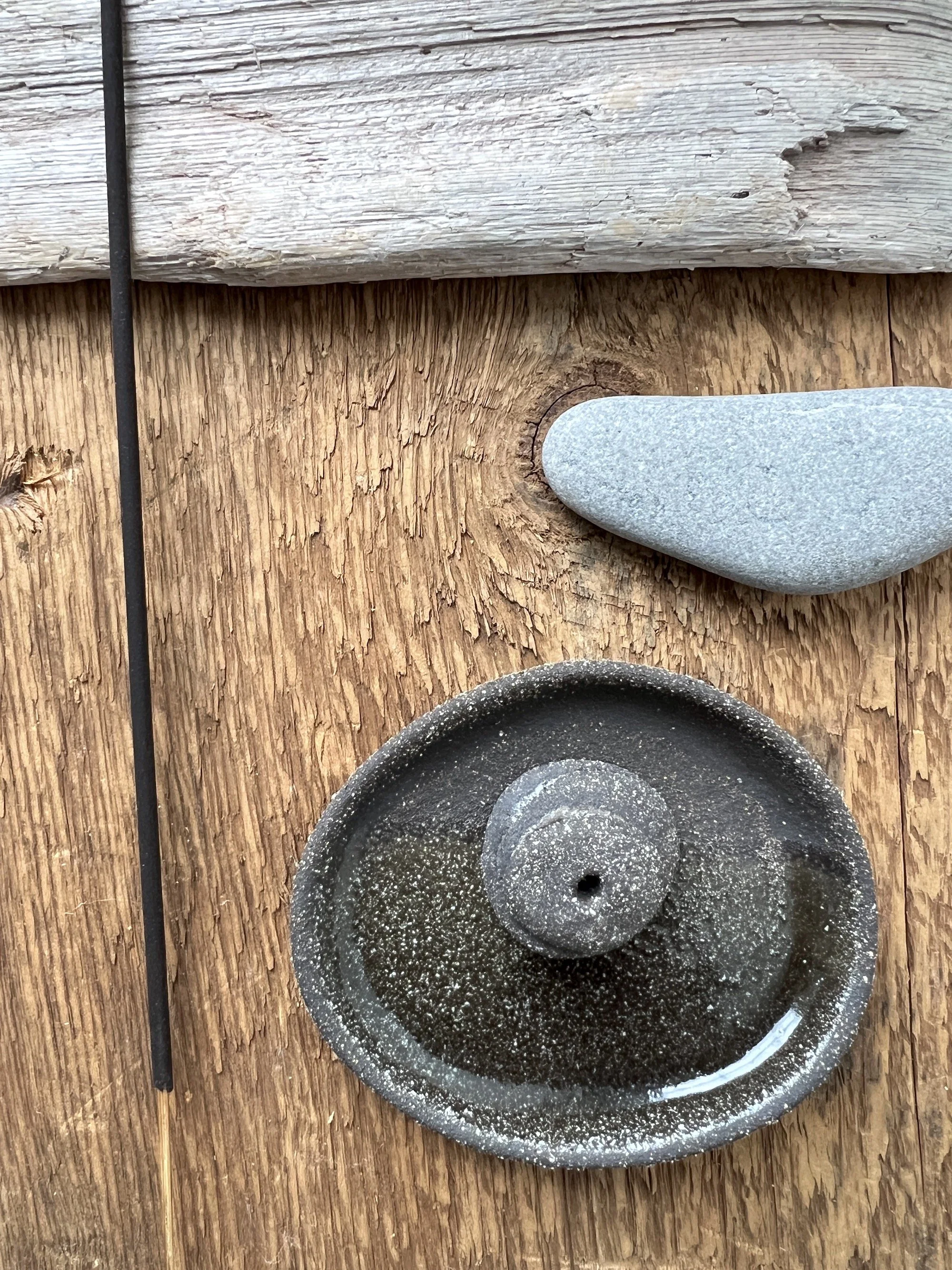 black pebble plate + incense cairn
