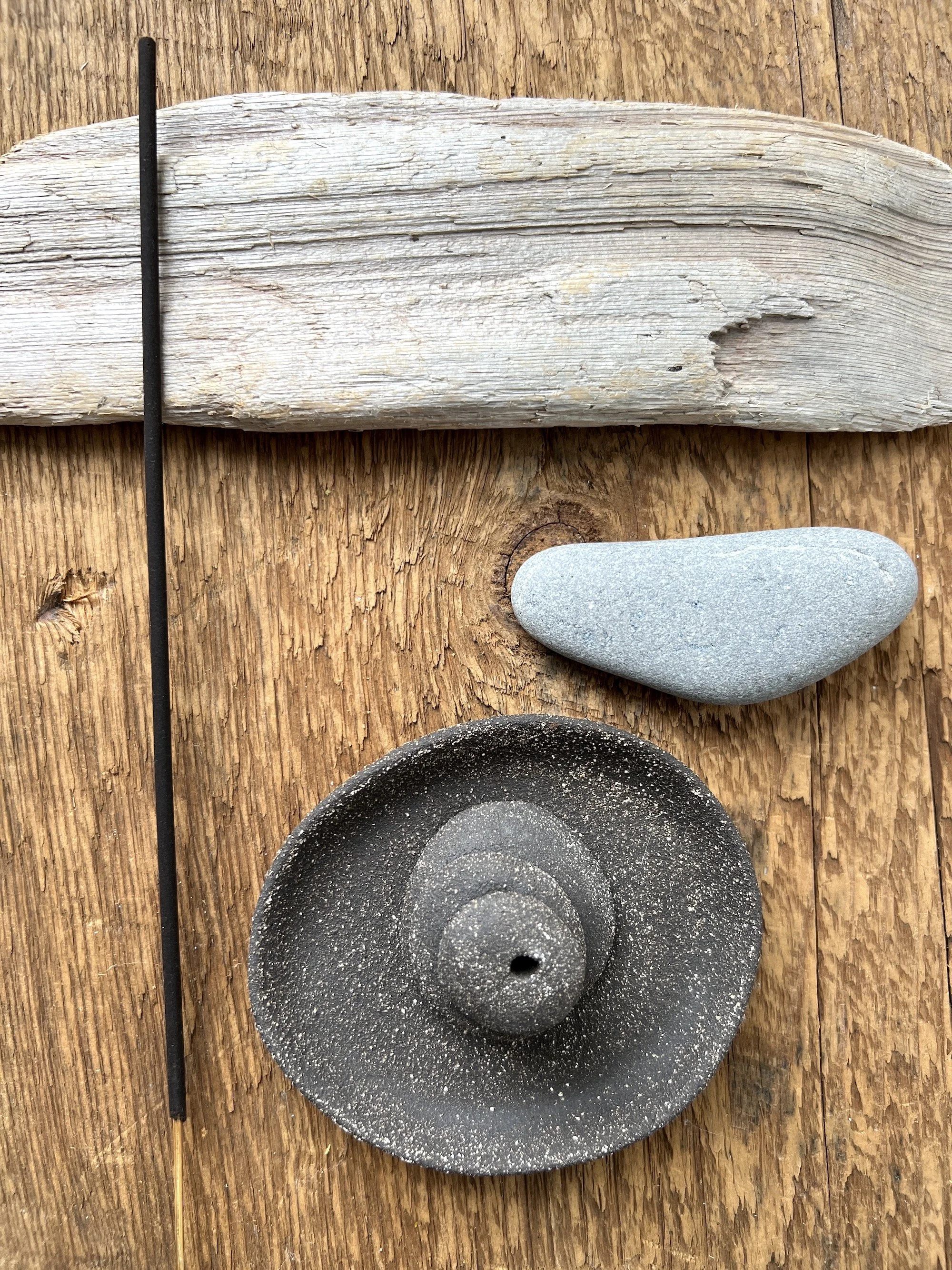 matte black pebble plate + incense cairn