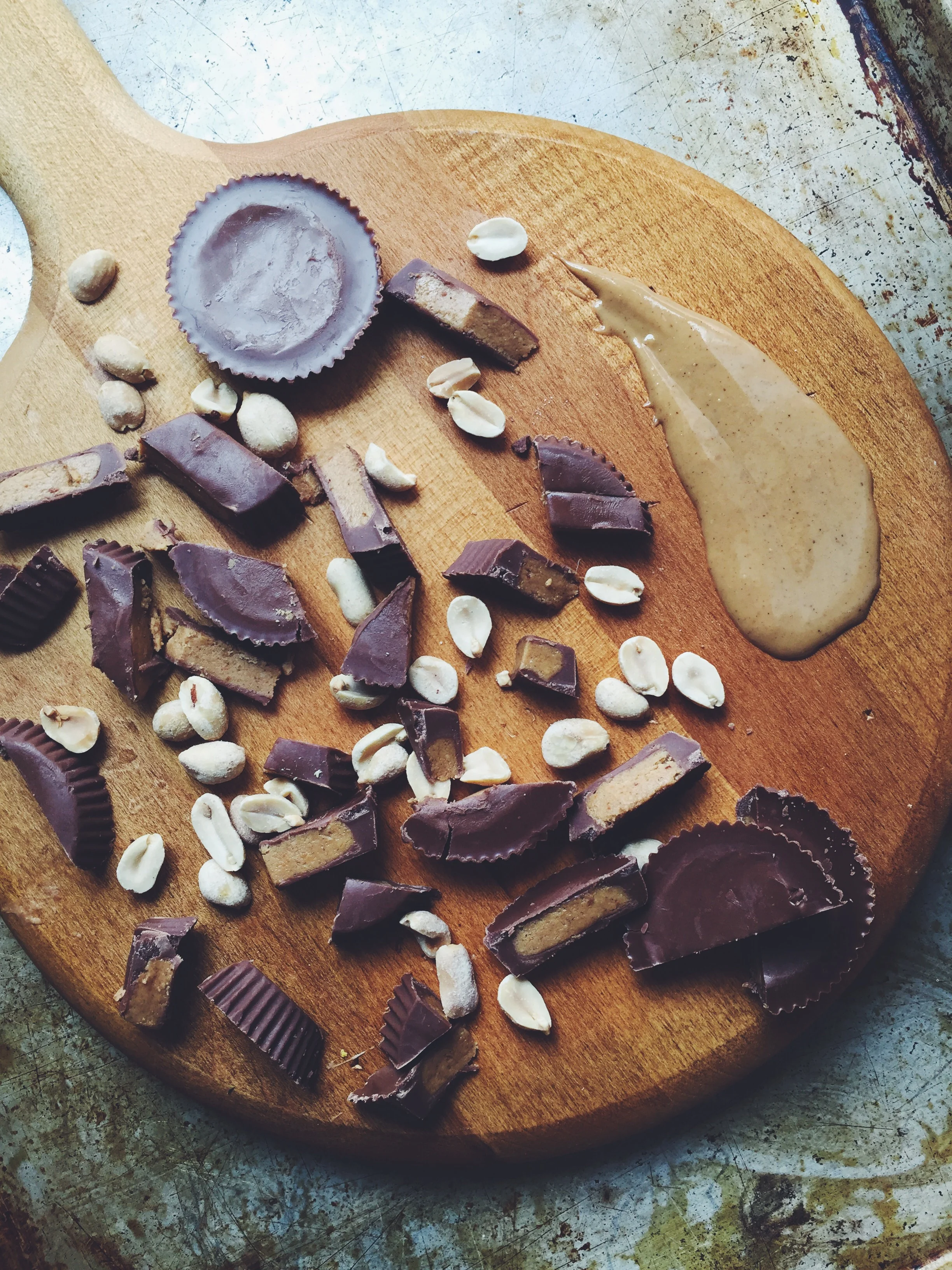 chocolate peanut butter cups + peanuts + peanut butter