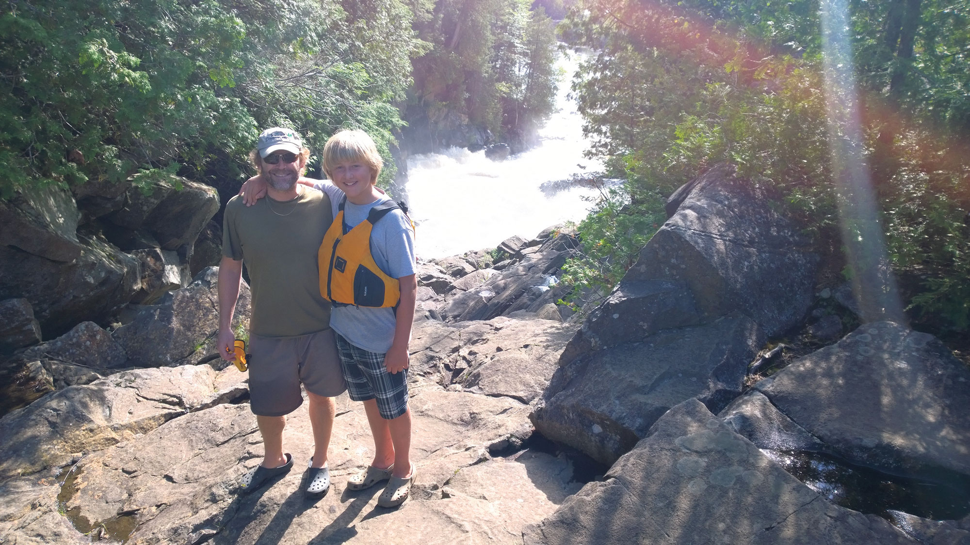 Dan Kraus (here with son Logan at Ragged Falls, Ontario) believes natural capital valuation can help Canadians better understand the benefits of conservation. NCC