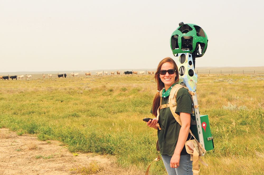 With the Google Trekker on her back, NCC’s Natalie Hassett walks through an NCC conservation area to record panoramic images that will soon be available on Google Street View. CALVIN FEHR