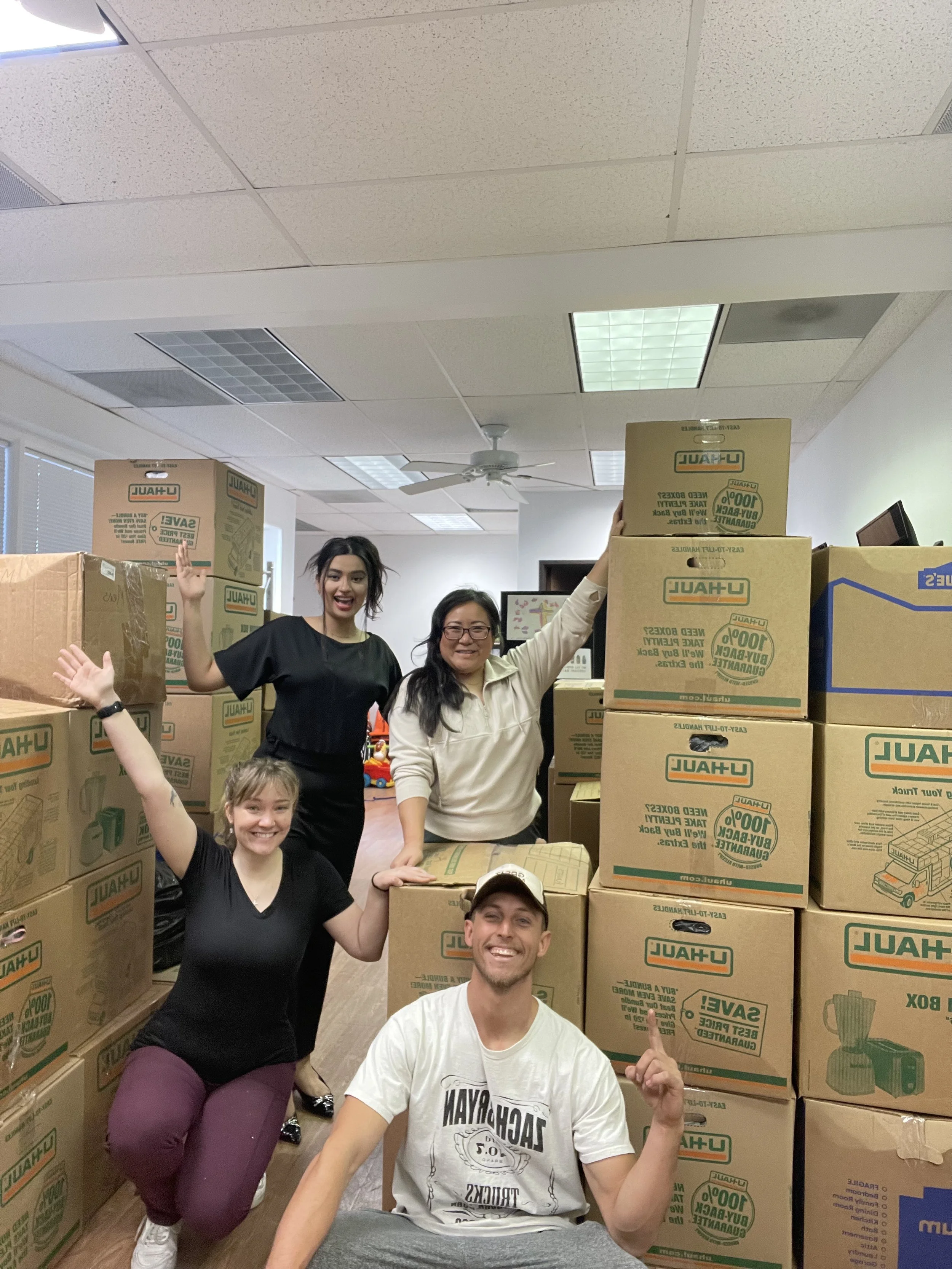 OCDC and Riverbank team posing with nearly 10 palettes worth of donations! 