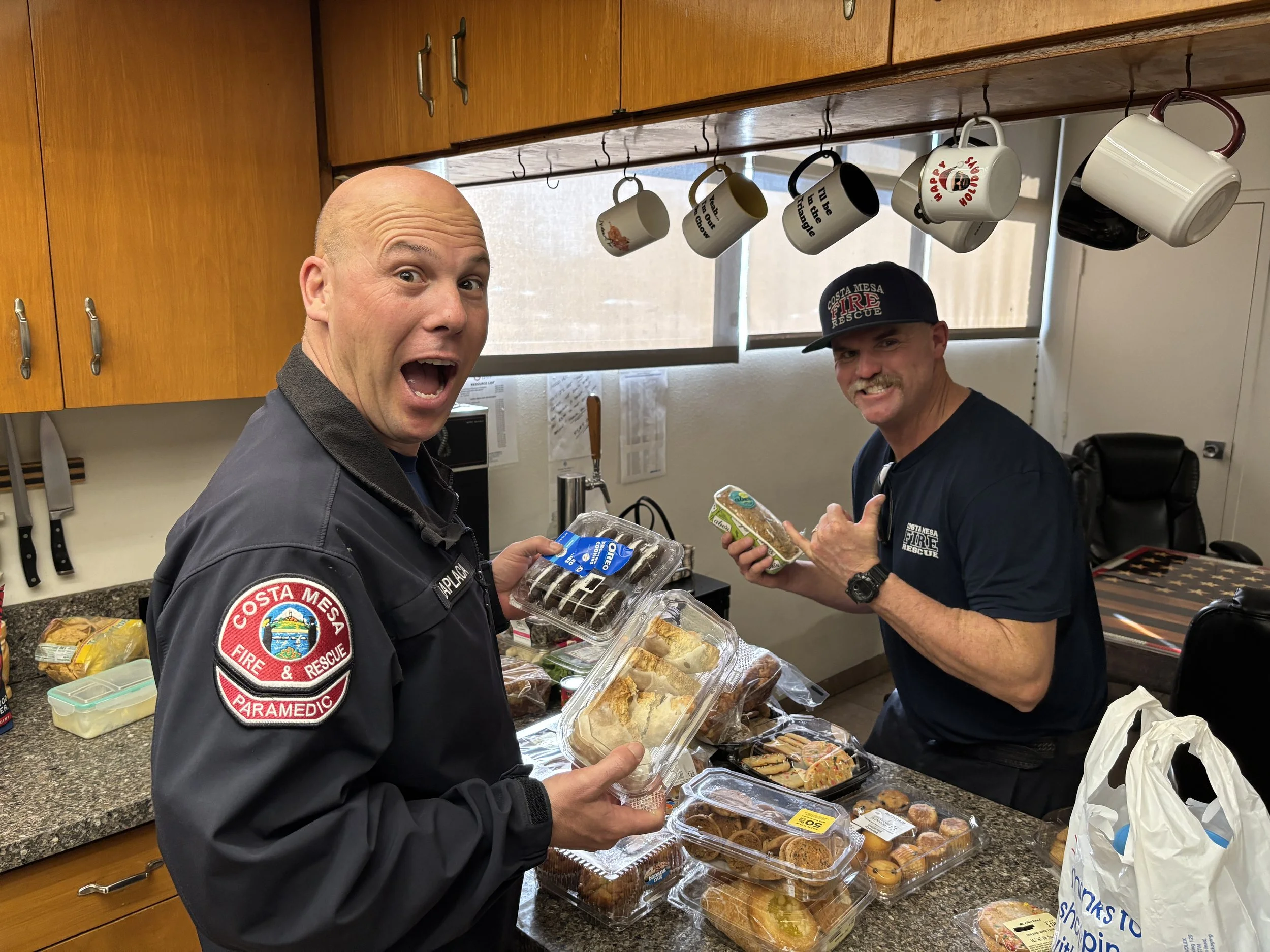 OC Firemen enjoying surprises dropped off by OCDC volunteers