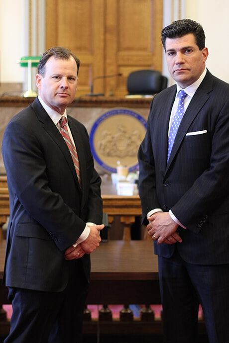 Philadelphia criminal defense lawyers Pierre LaTour and Josh Scarpello standing in a court room.